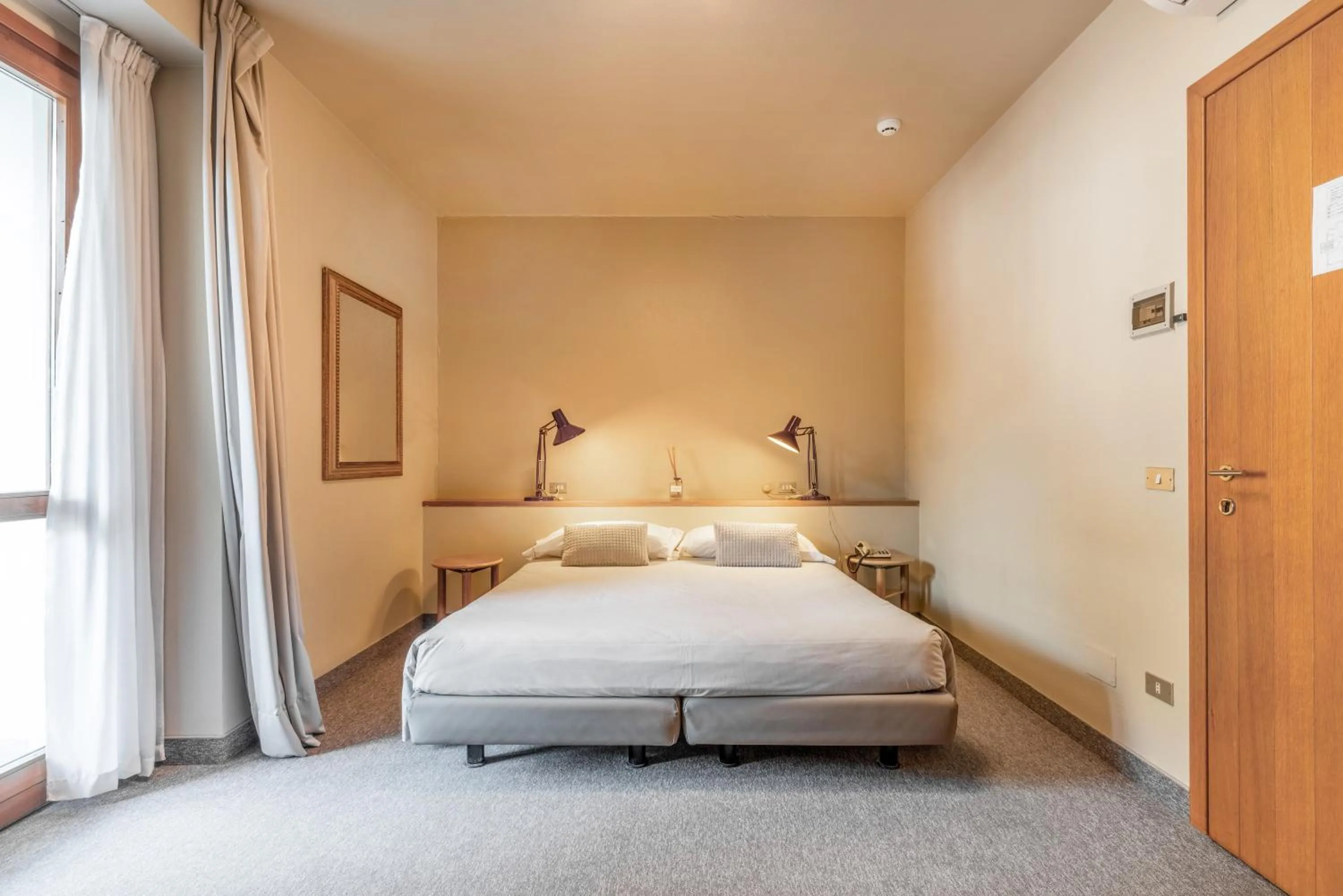 Bed in Albergo Sorriso