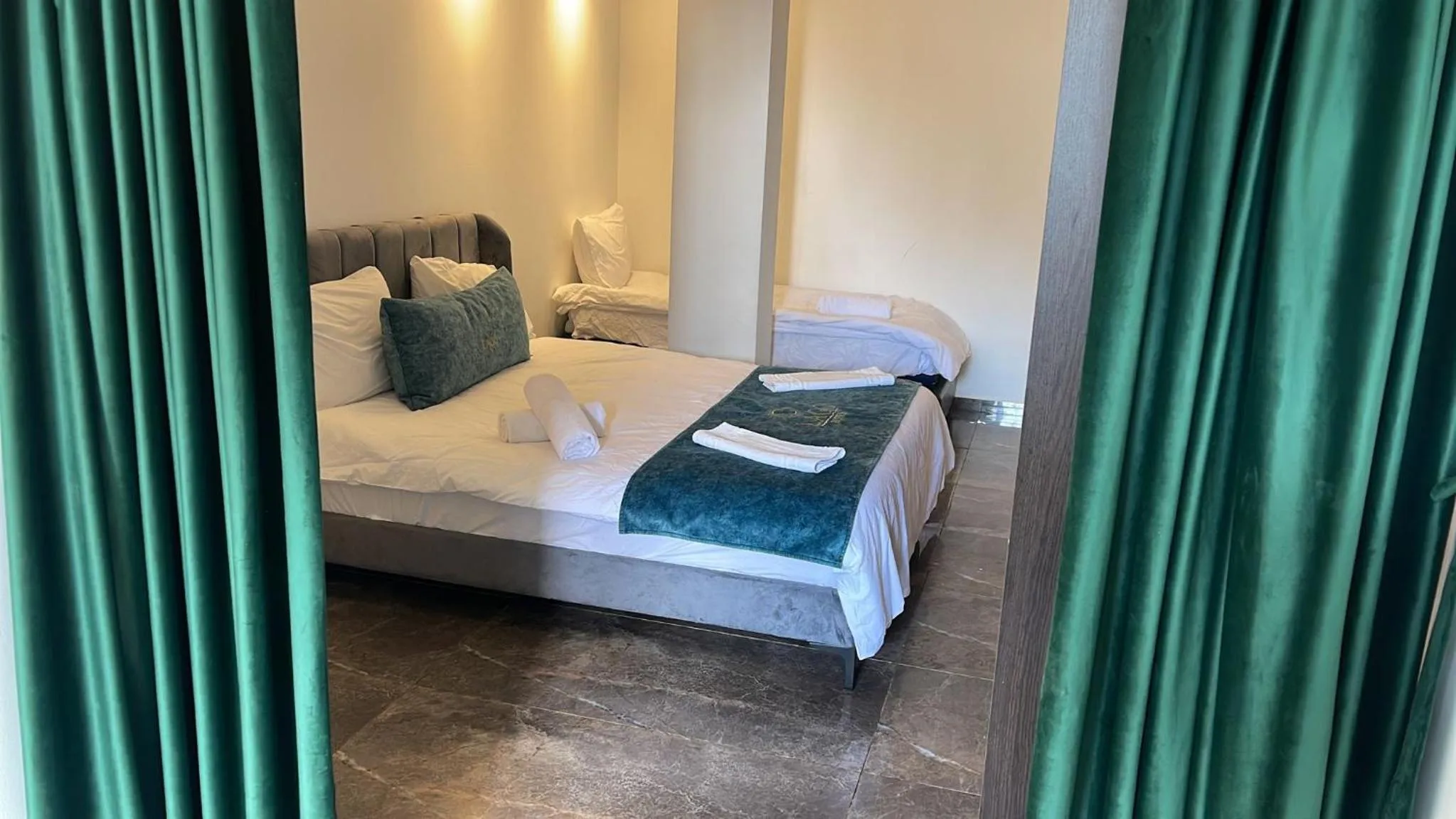 Bed in Lago Suites Hotel