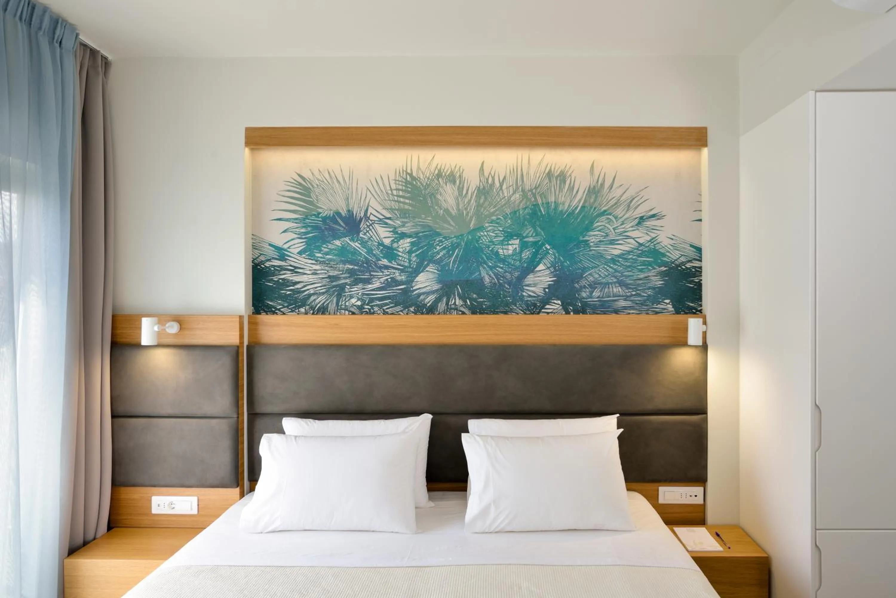 Bed in Elia Kalamaki Hotel