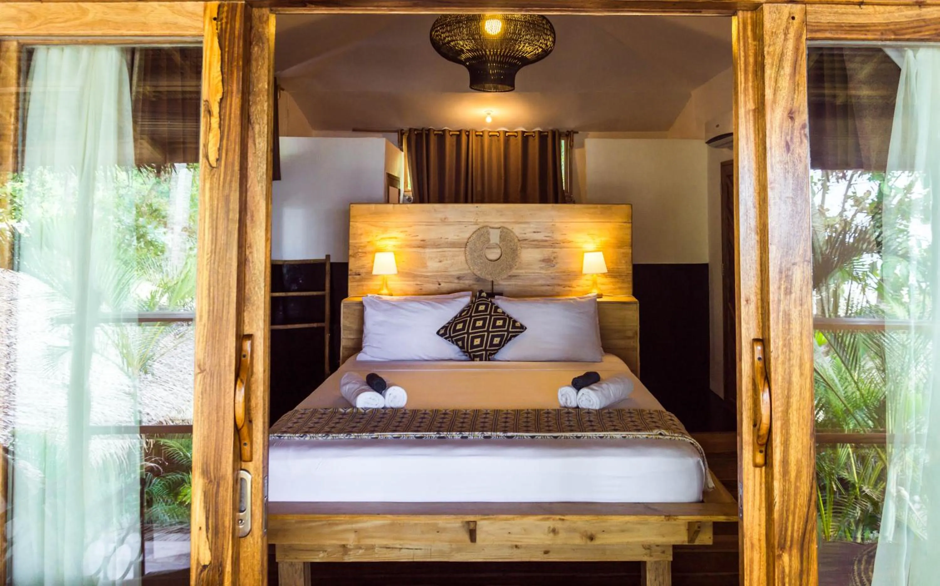 Bed in Maligaya Beach Bungalows