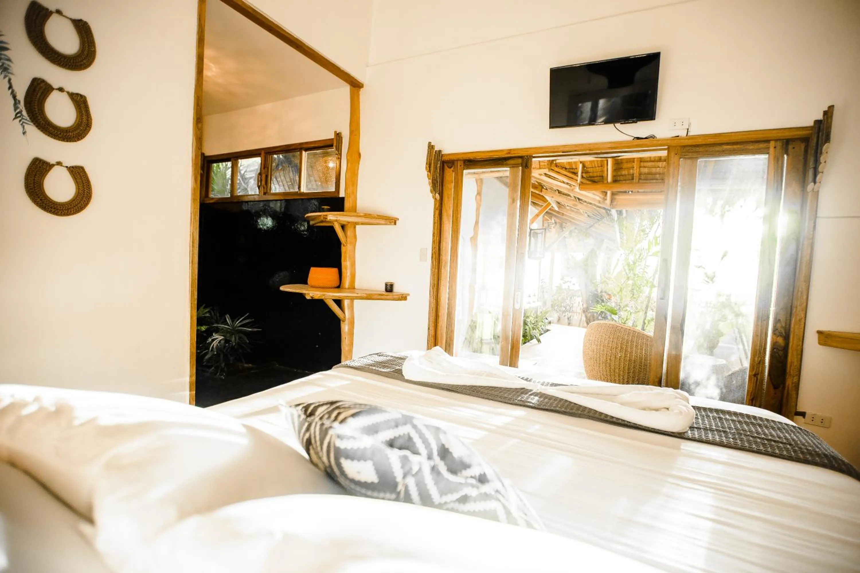 Bed in Maligaya Beach Bungalows