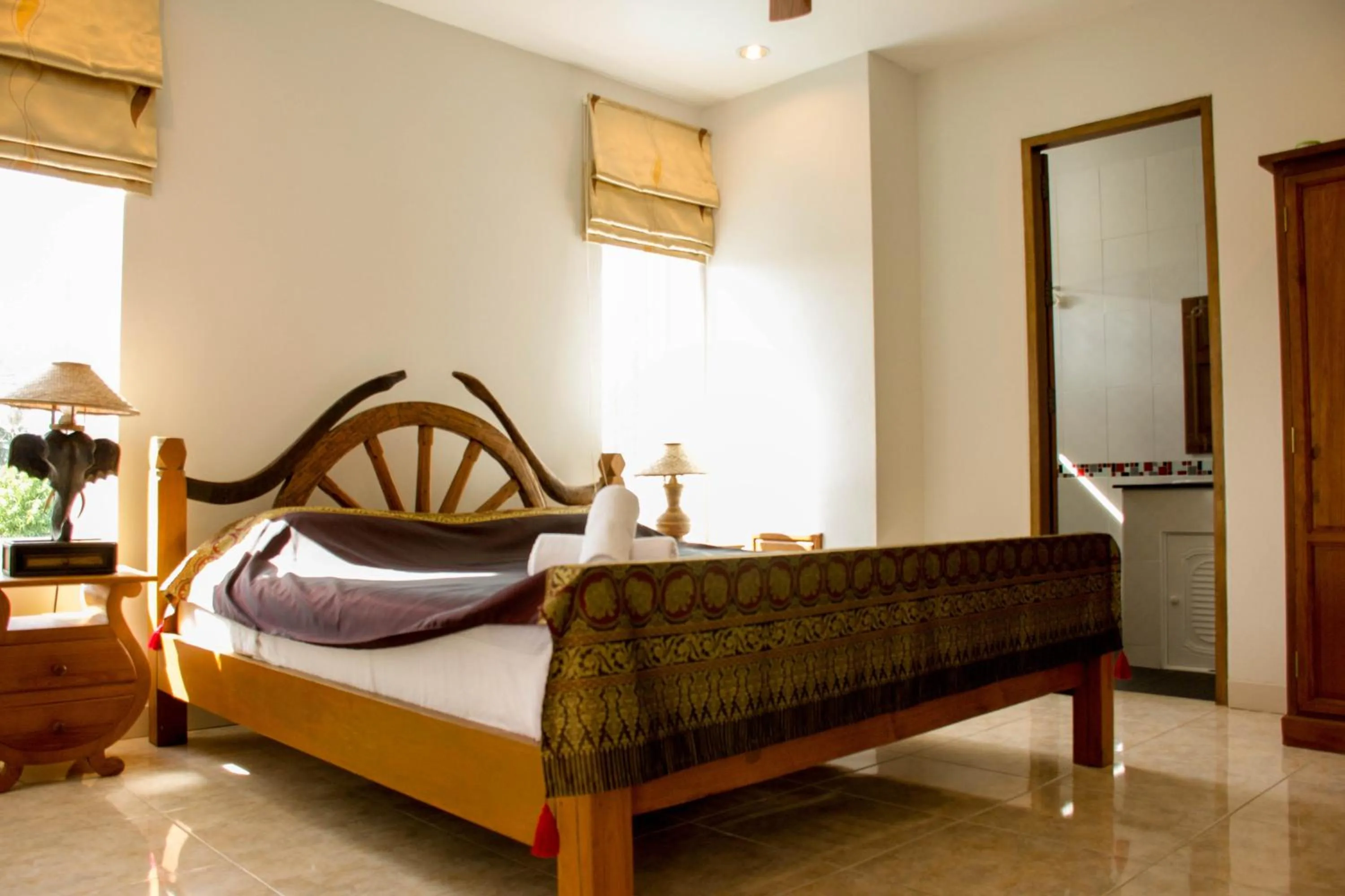 Bed in Baan Rosa Bangtao Beach