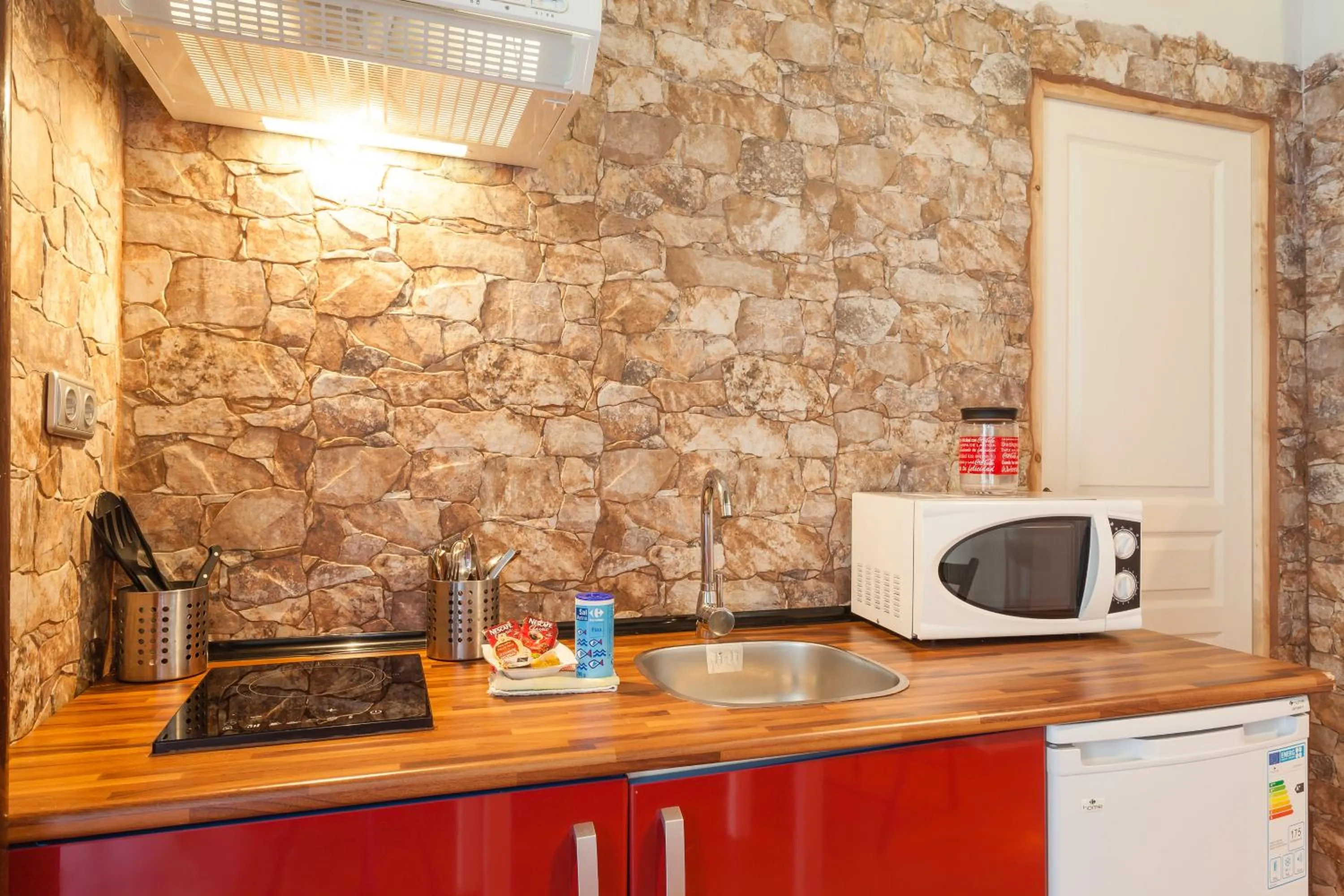 Kitchen or kitchenette in Apartamentos Jerez