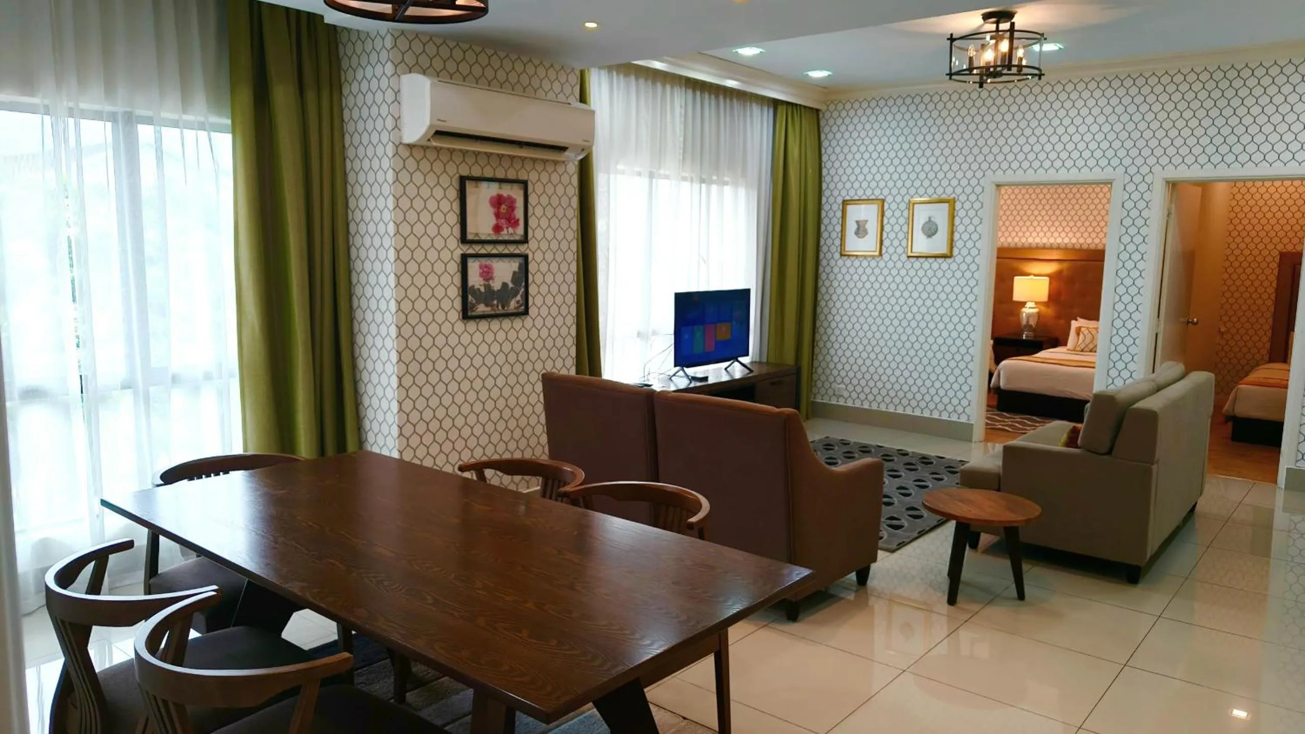 Living room, Bed in RPGC Garden Hotel