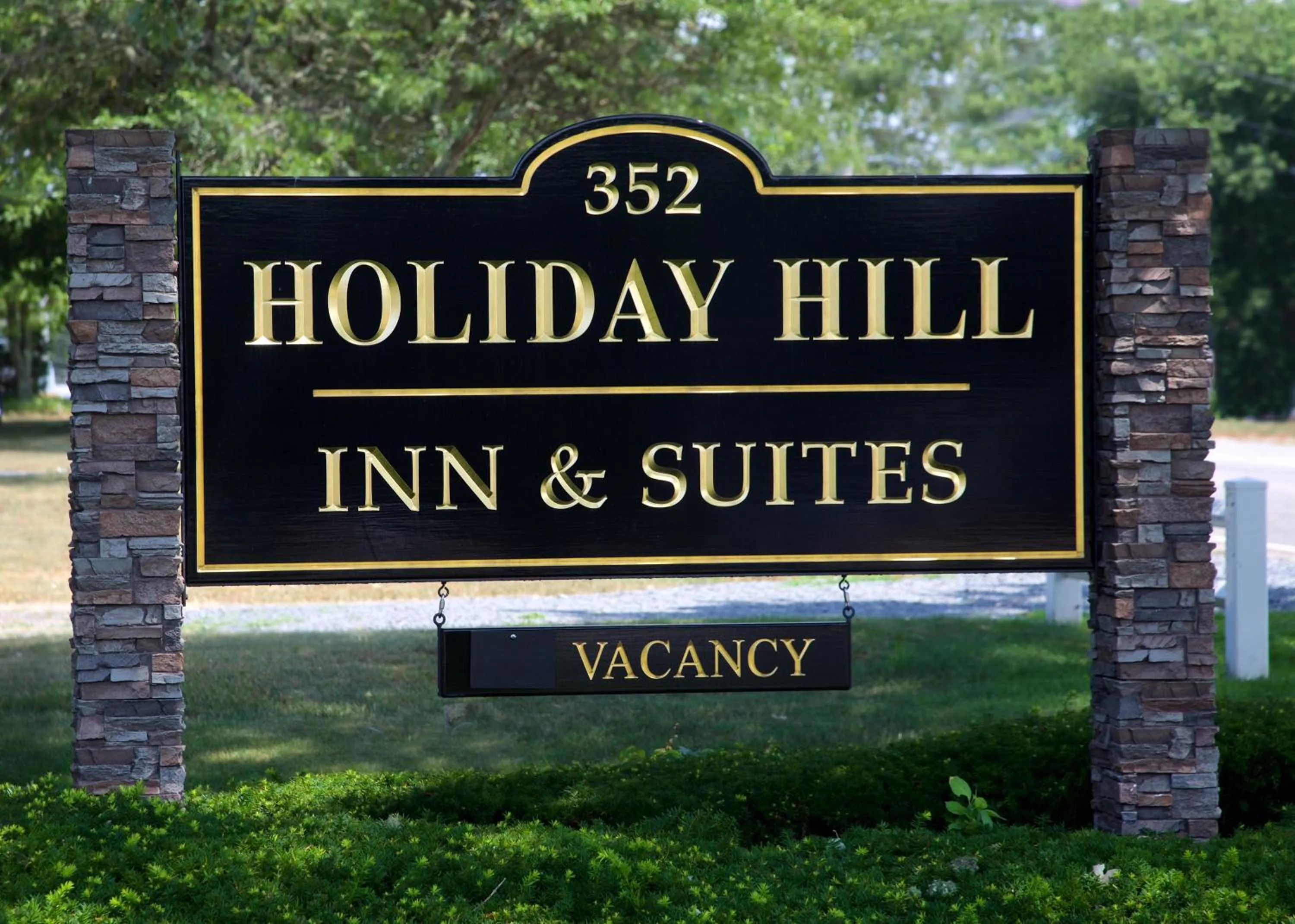 Property logo or sign in Holiday Hill Inn & Suites