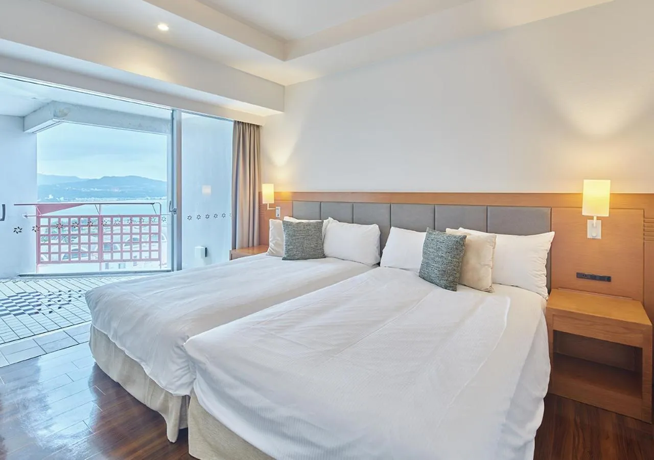 Photo of the whole room, Bed in Hotel Mahaina Wellness Resorts Okinawa