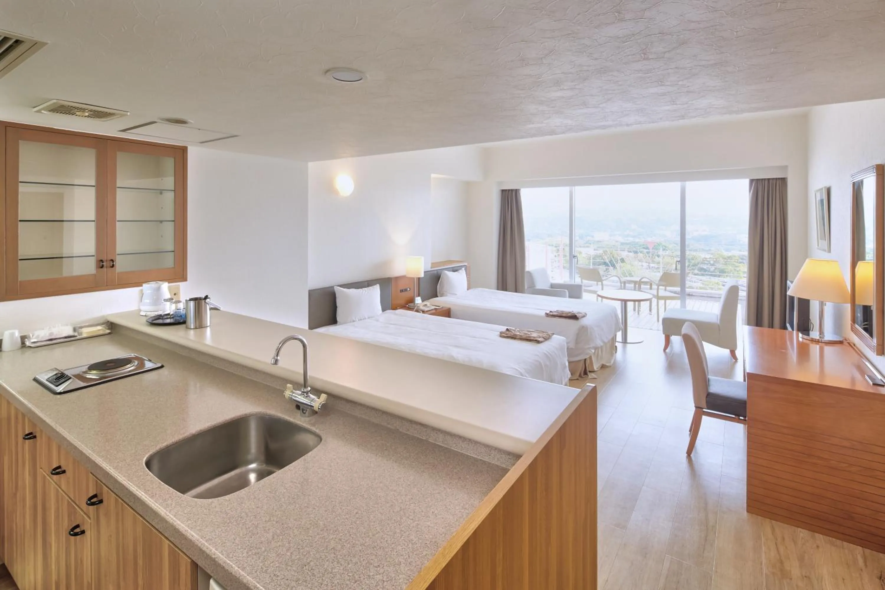 Kitchen or kitchenette, Bed in Hotel Mahaina Wellness Resorts Okinawa