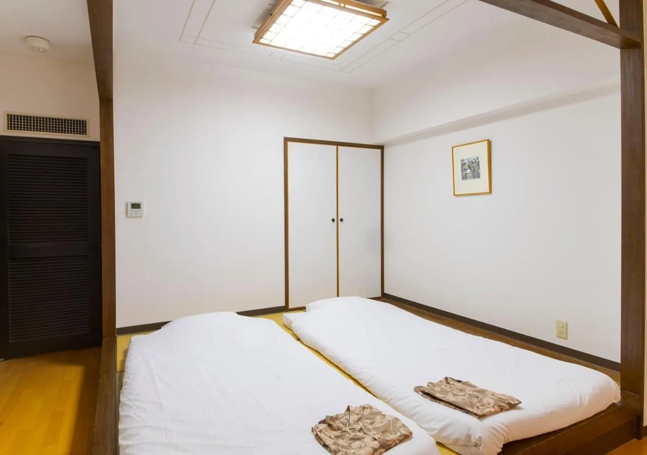 Photo of the whole room, Bed in Hotel Mahaina Wellness Resorts Okinawa