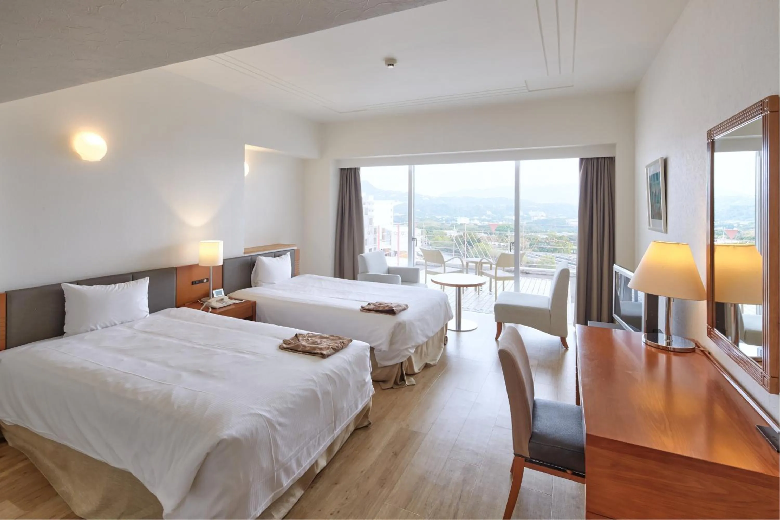 Photo of the whole room, Bed in Hotel Mahaina Wellness Resorts Okinawa