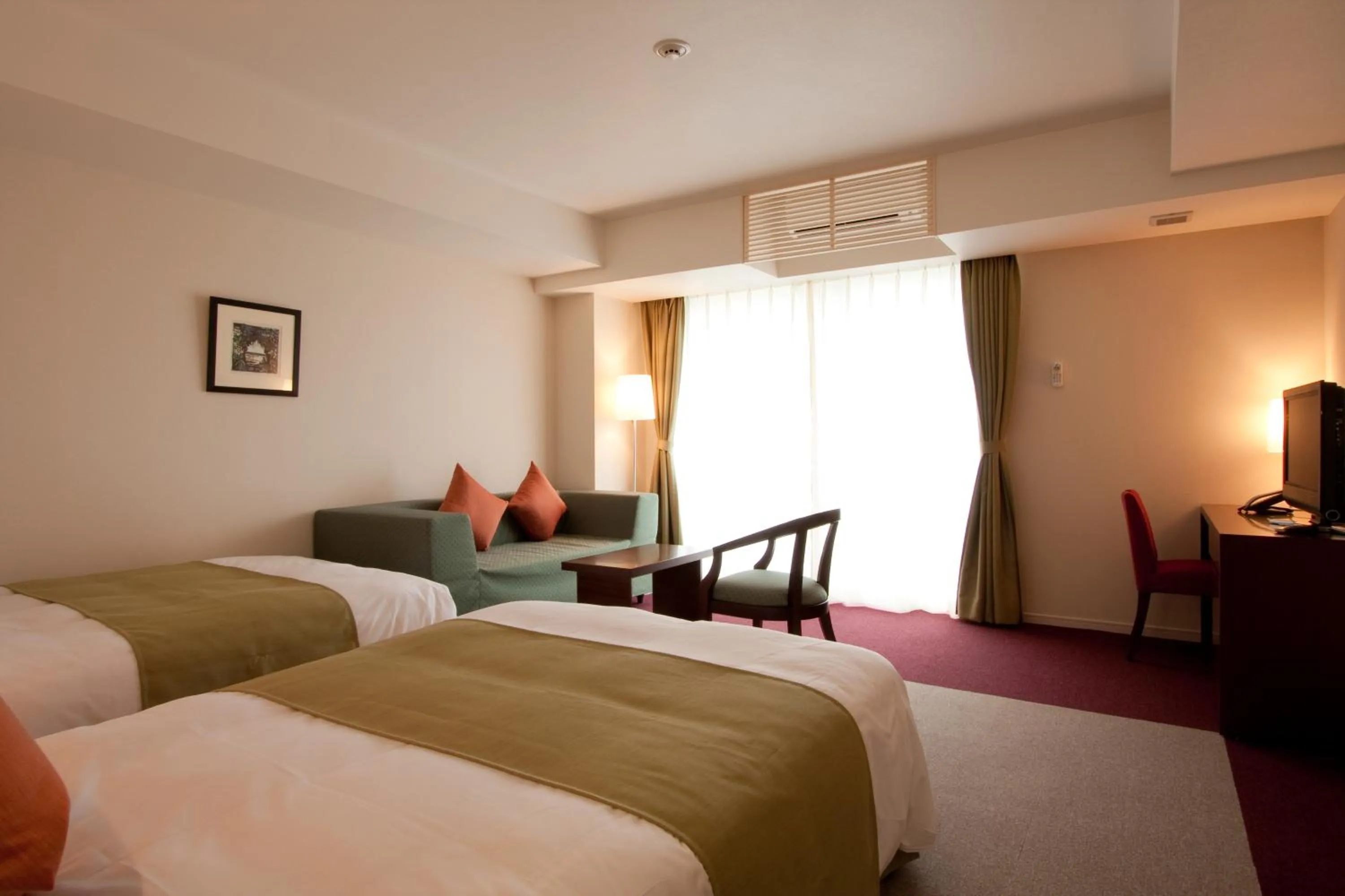 Photo of the whole room, Bed in Hotel Yugaf Inn Okinawa