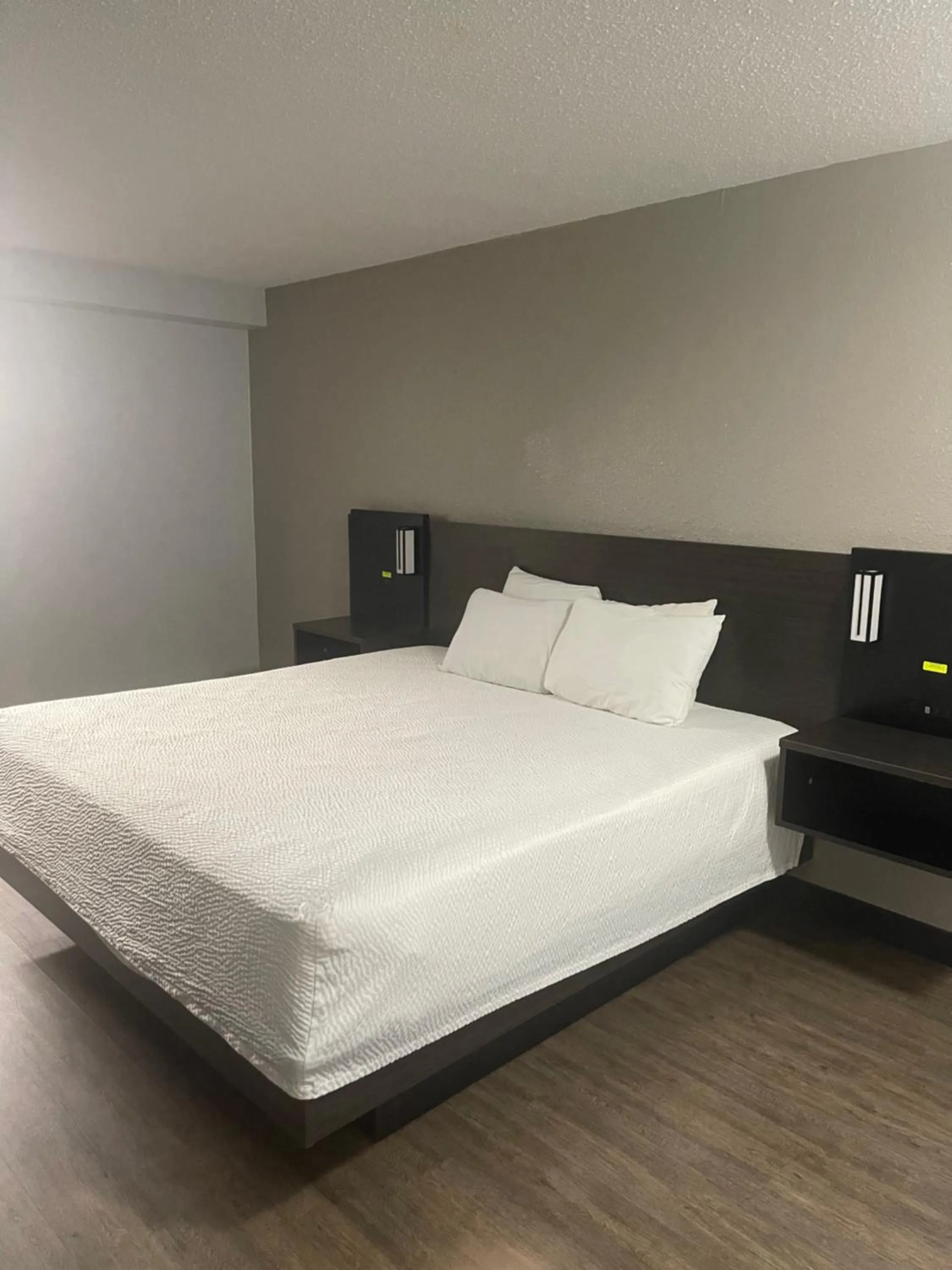 Bed in FairBridge Inn & Suites