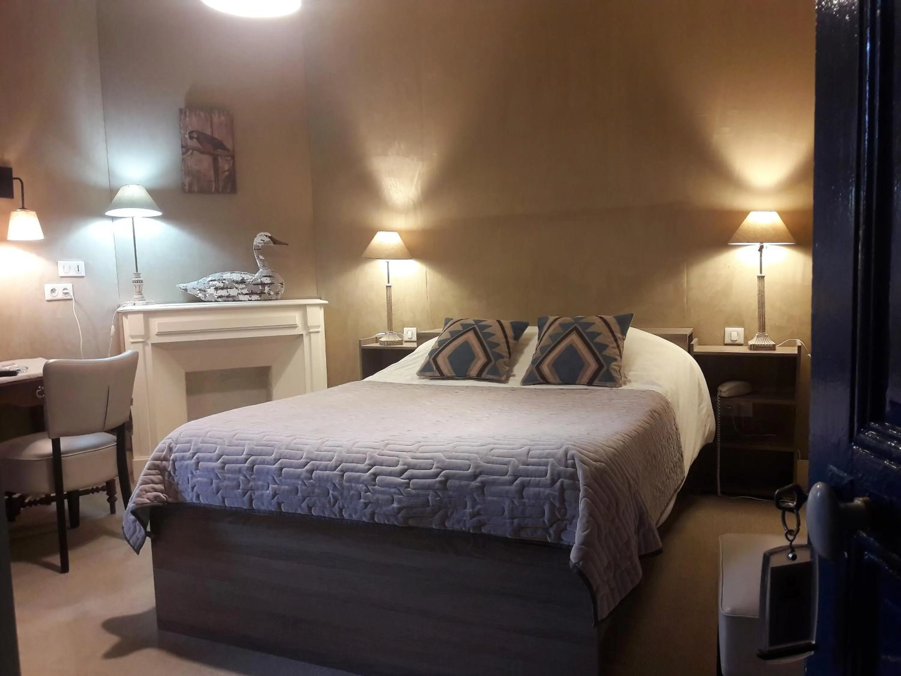 Bed in LogisHotels Le Relais du Quercy