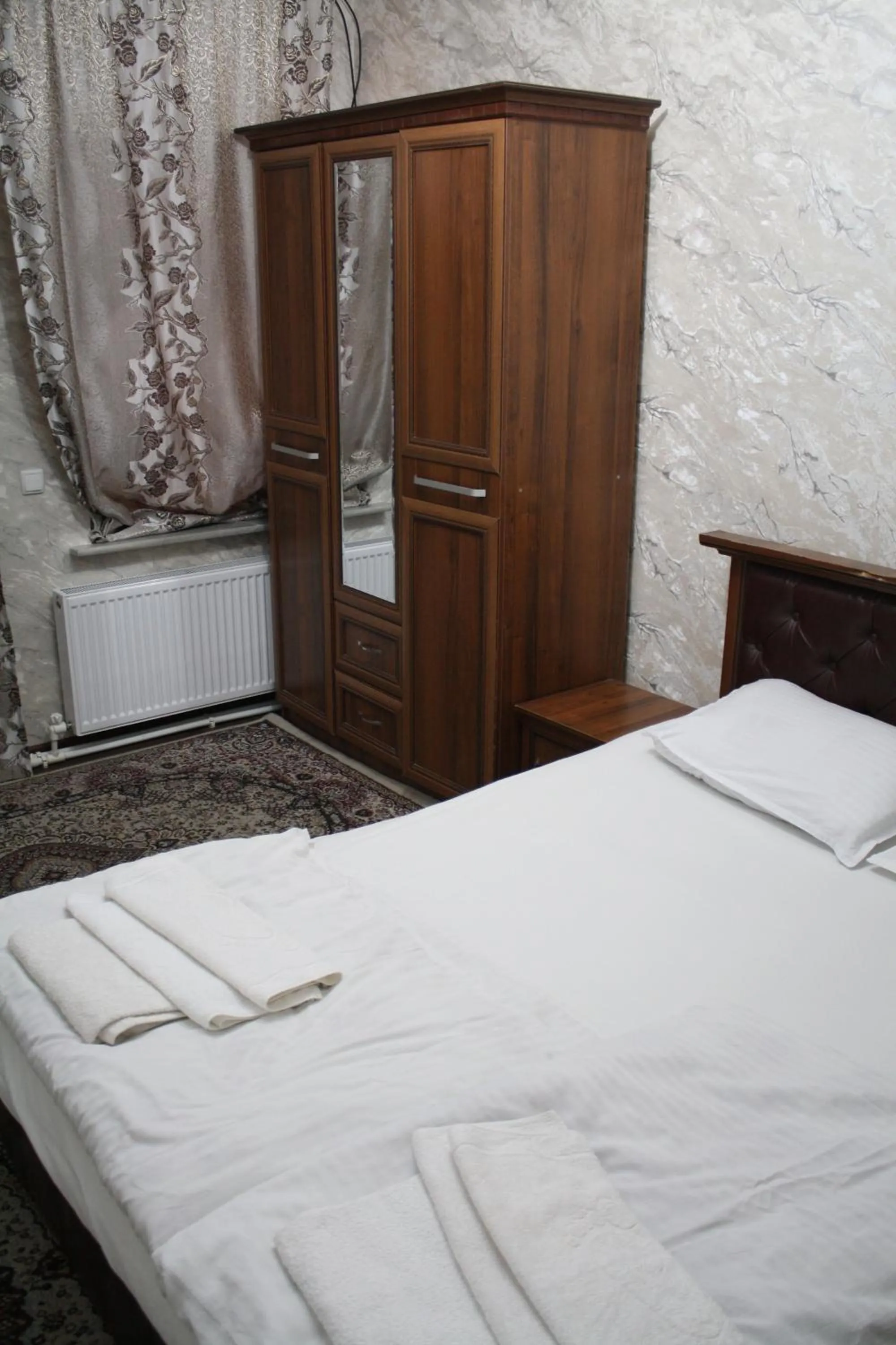 Bed in Tilyakori Hotel