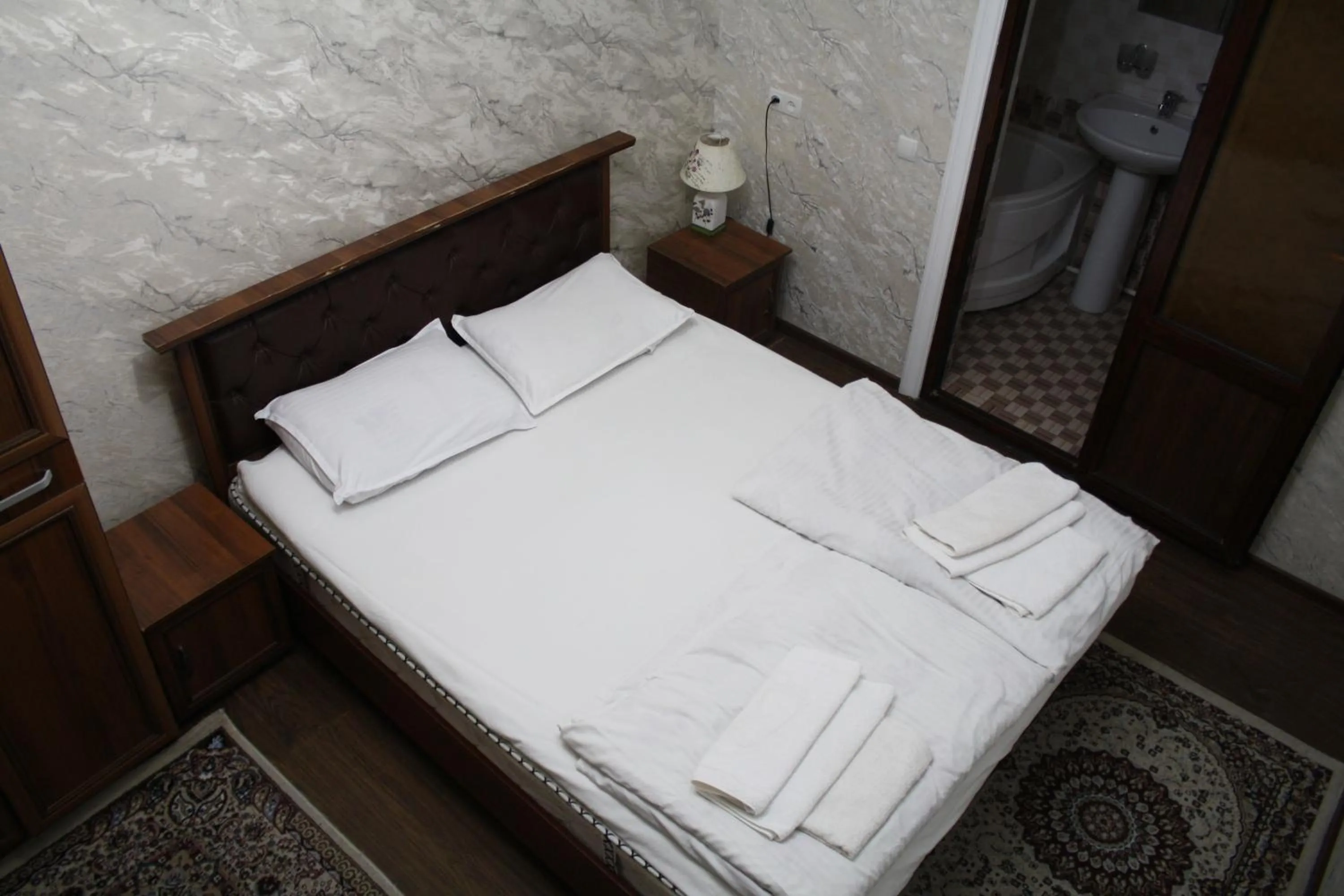 Bed in Tilyakori Hotel