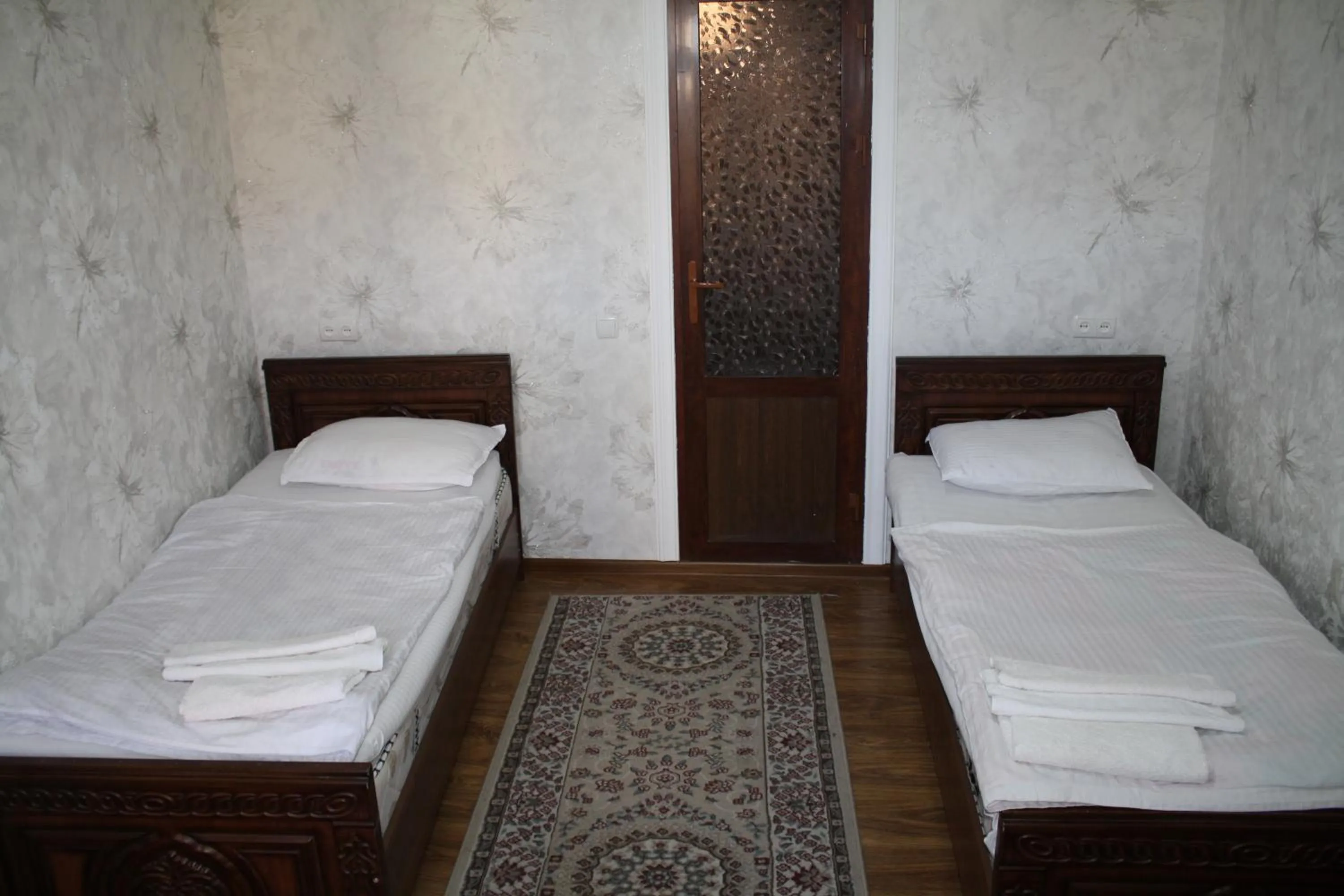 Bed in Tilyakori Hotel