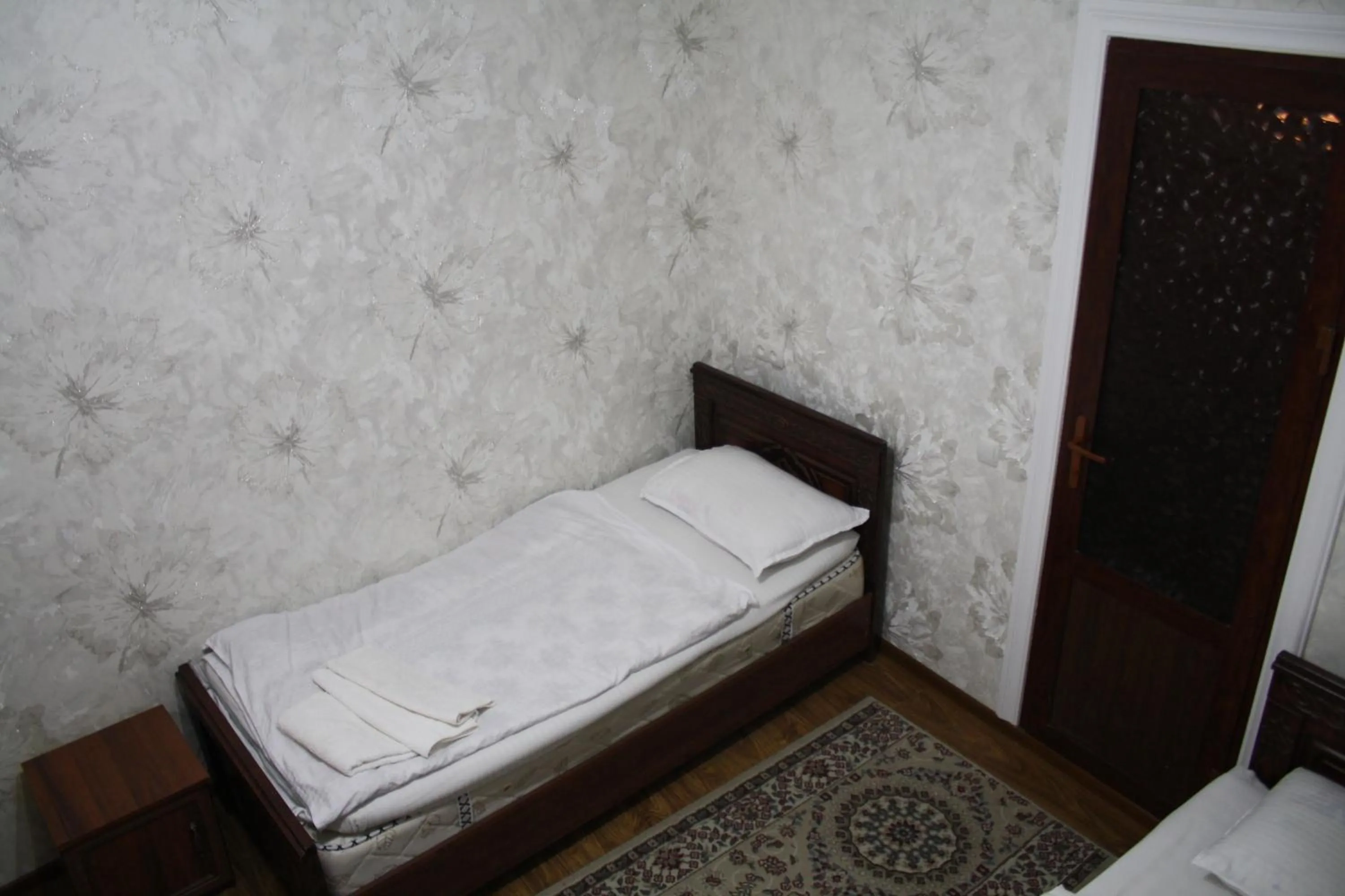 Bed in Tilyakori Hotel