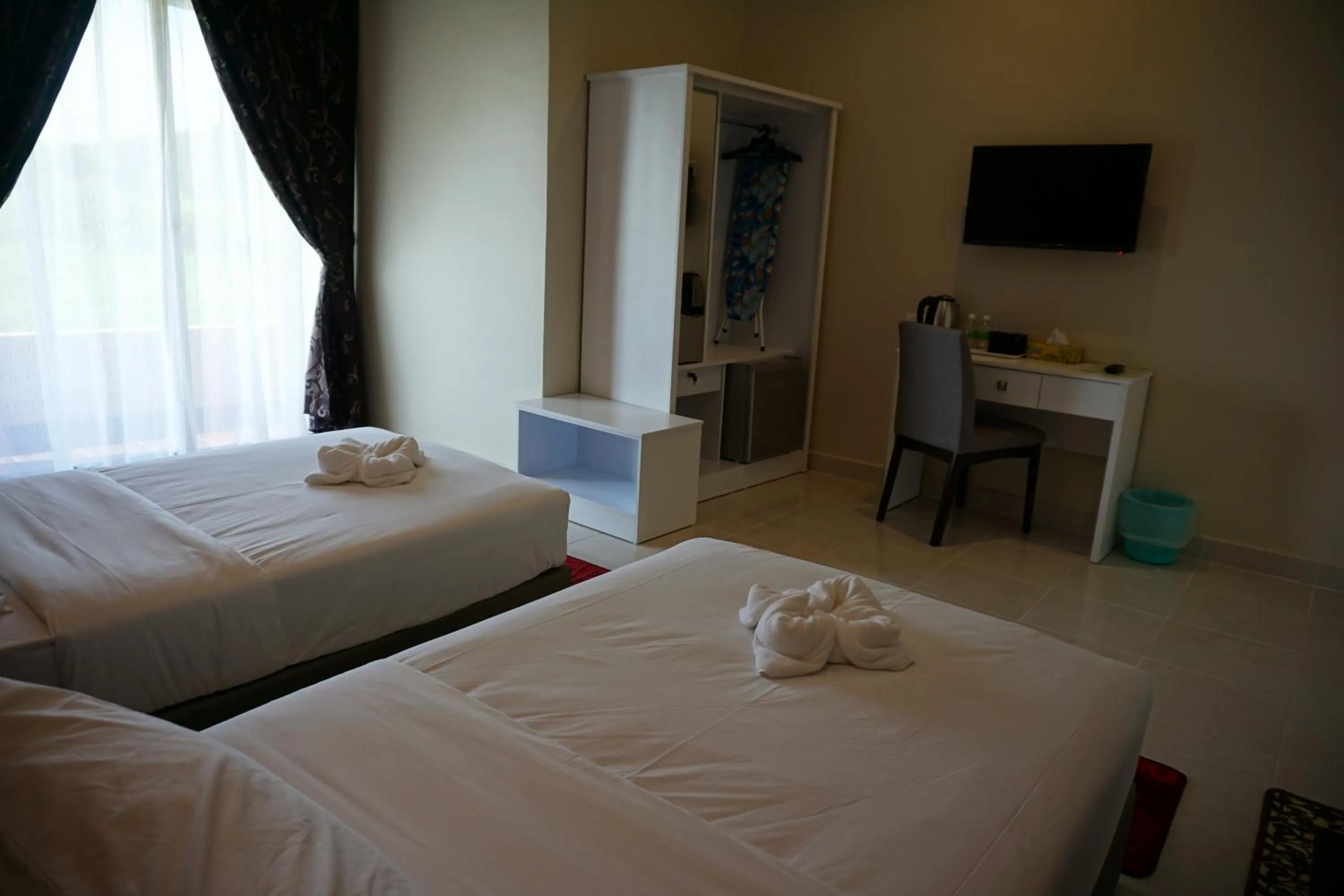 Bed in Nahdhoh Langkawi Resort