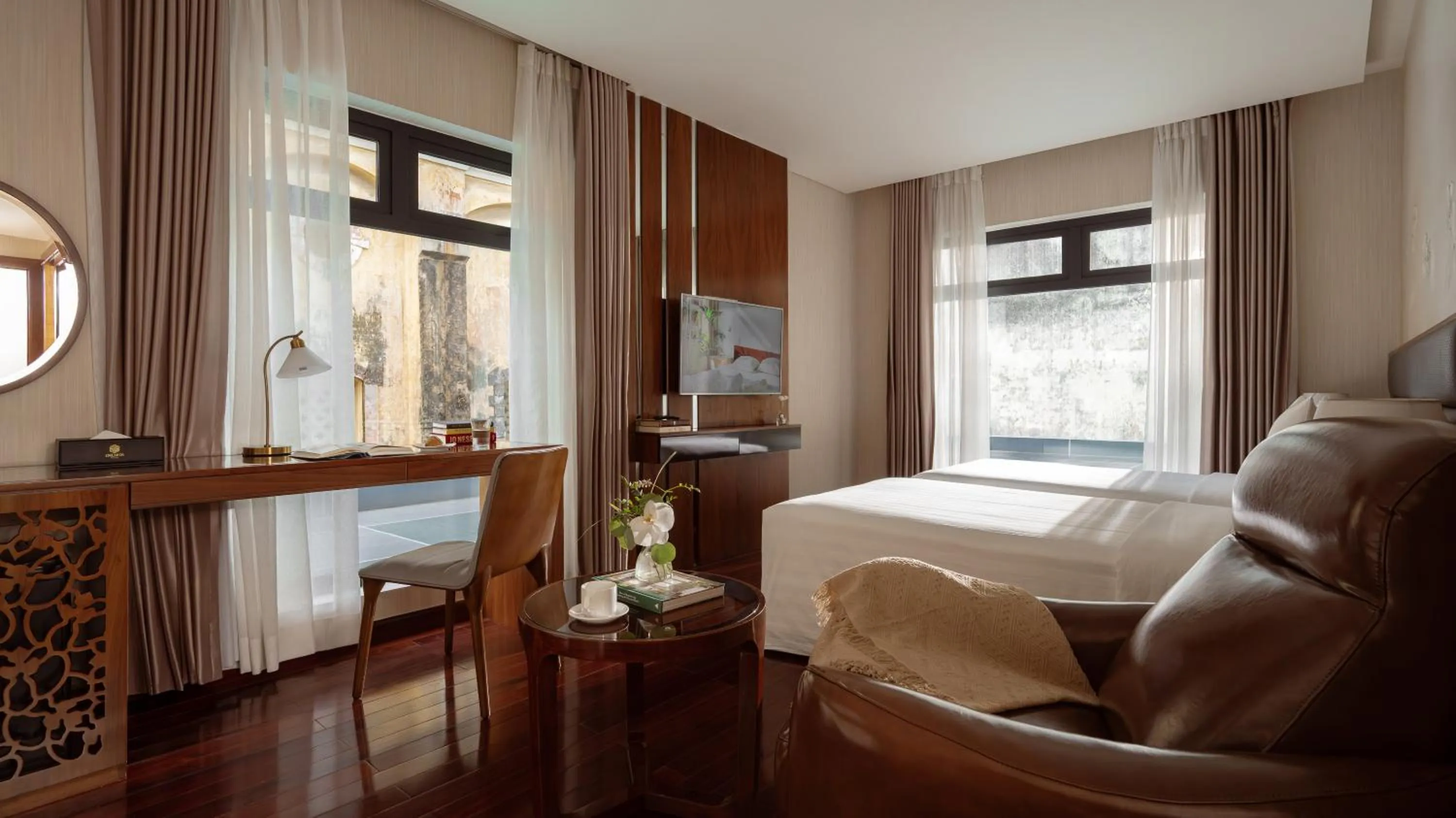 Bed in Orchids Saigon Hotel