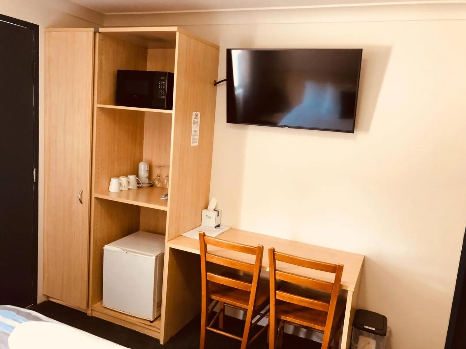 Bed in Red Cedar Motel