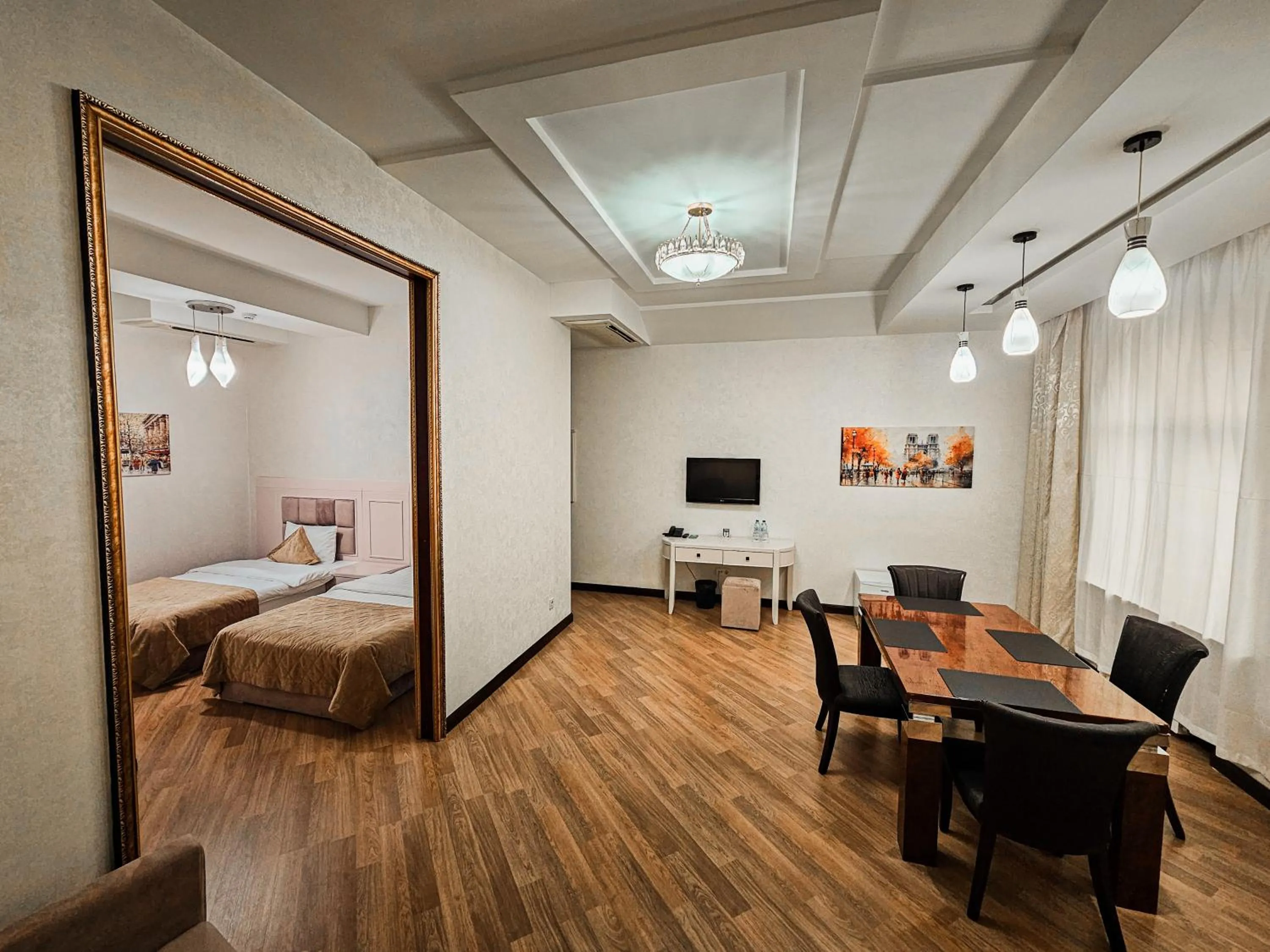 Communal lounge/ TV room, Bed in Safran Hotel