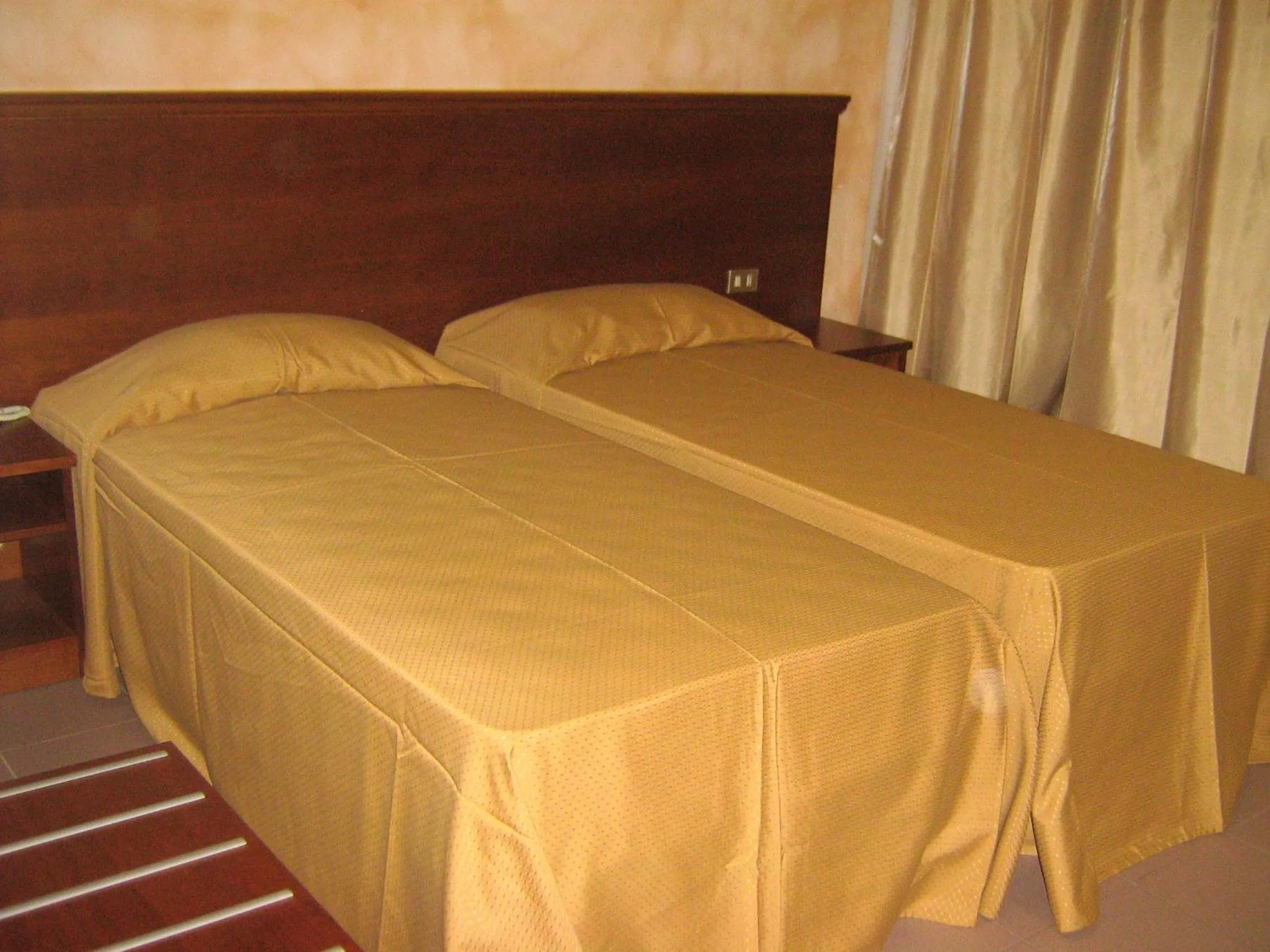 Bed in Hostiliae Ciminiera Hotel