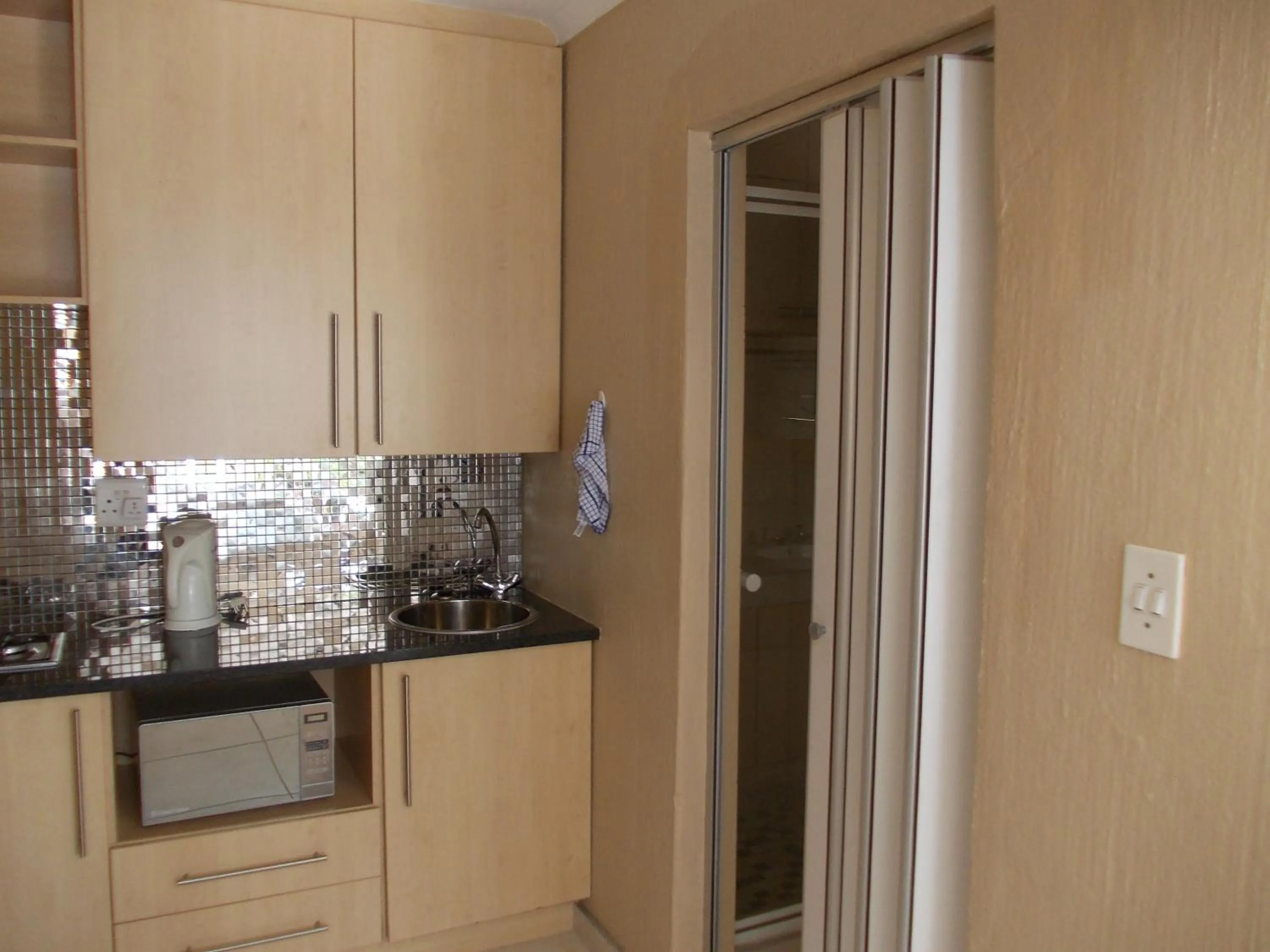 Kitchen or kitchenette in Homestay Travel Guest House