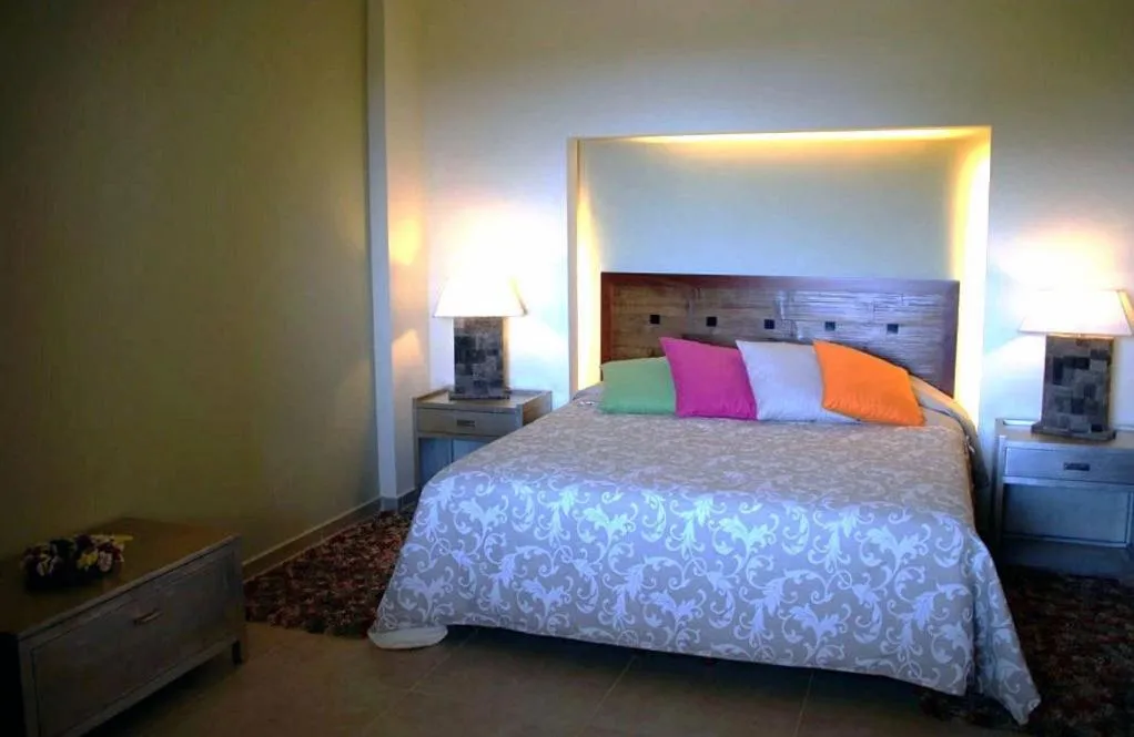 Bed in Astrolabe Hotel