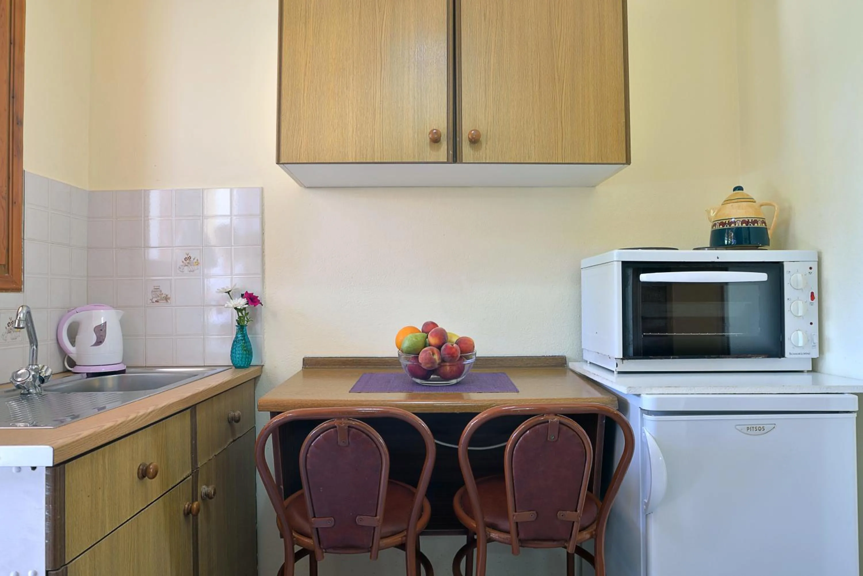 Kitchen or kitchenette in Feeloxenia Corfu Apartments