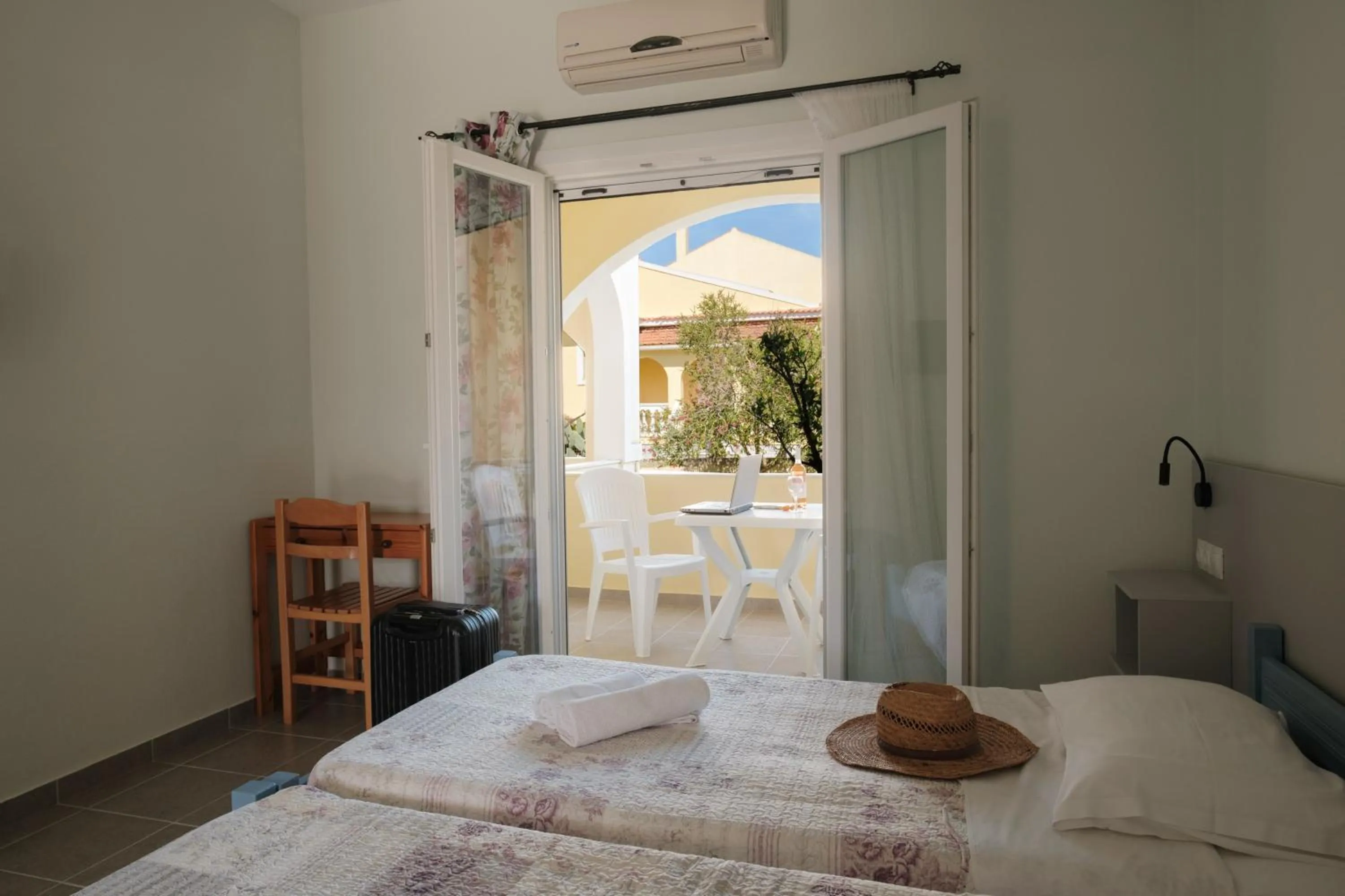 Bed in Feeloxenia Corfu Apartments