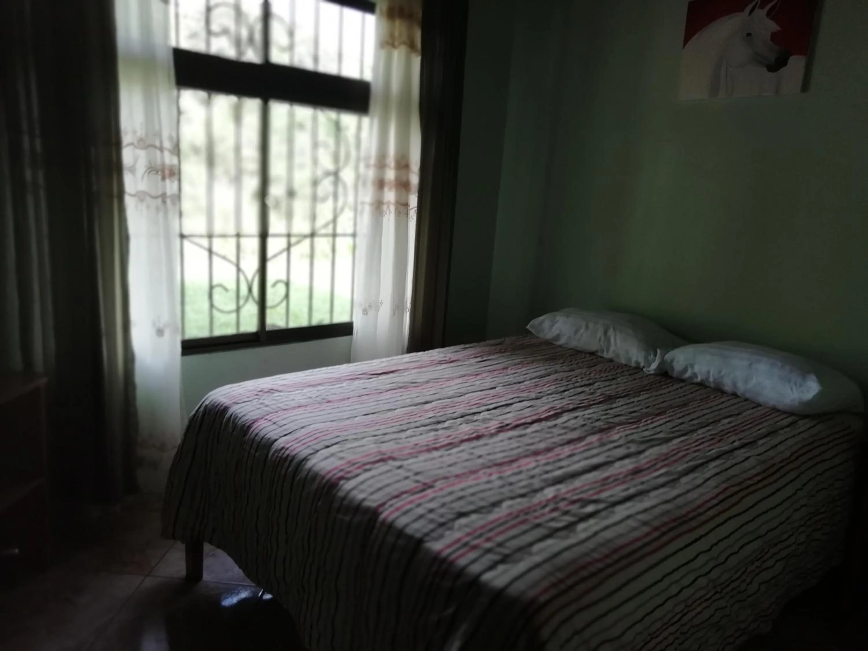 Bed in Casas de Campo Las Pavitas Cottages "Red Frog"