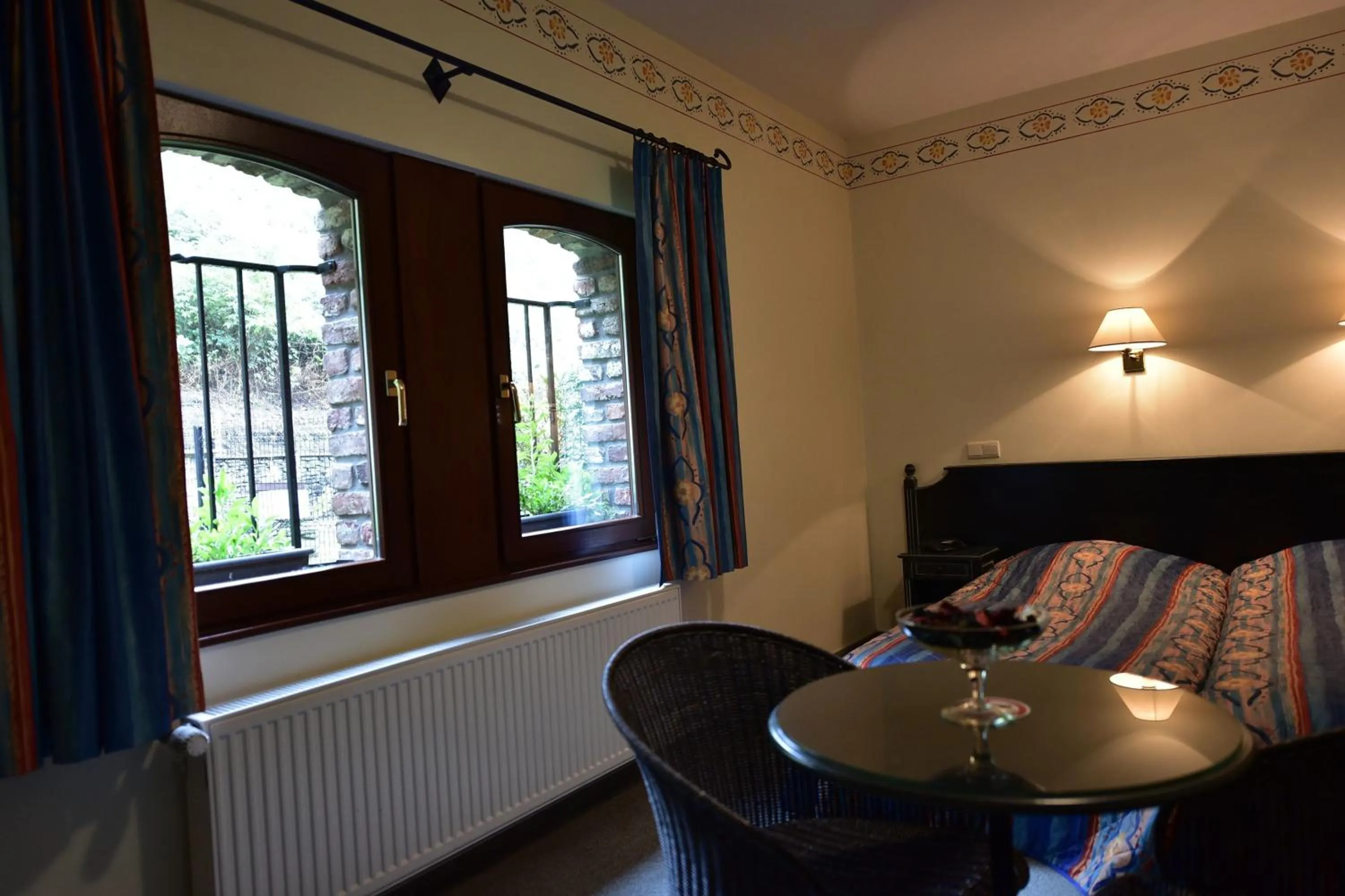 Bed in Hôtel Moulin de la Strument