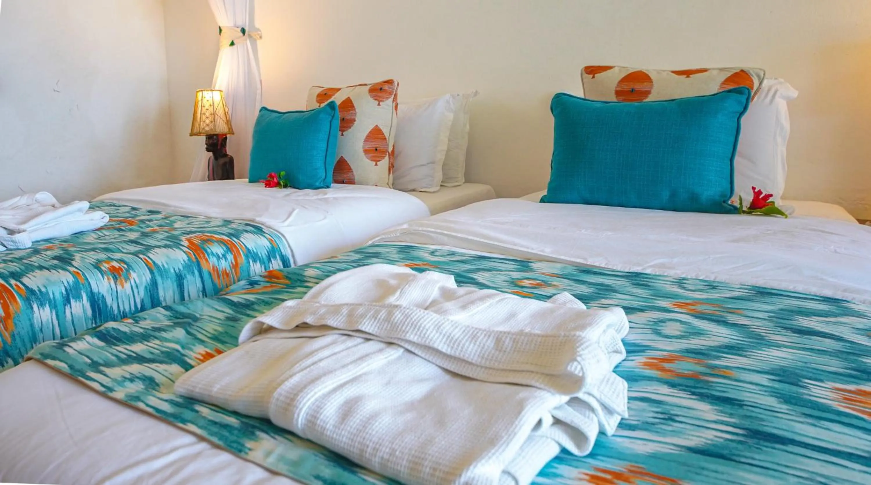 Bed in Papillon Lagoon Reef Hotel