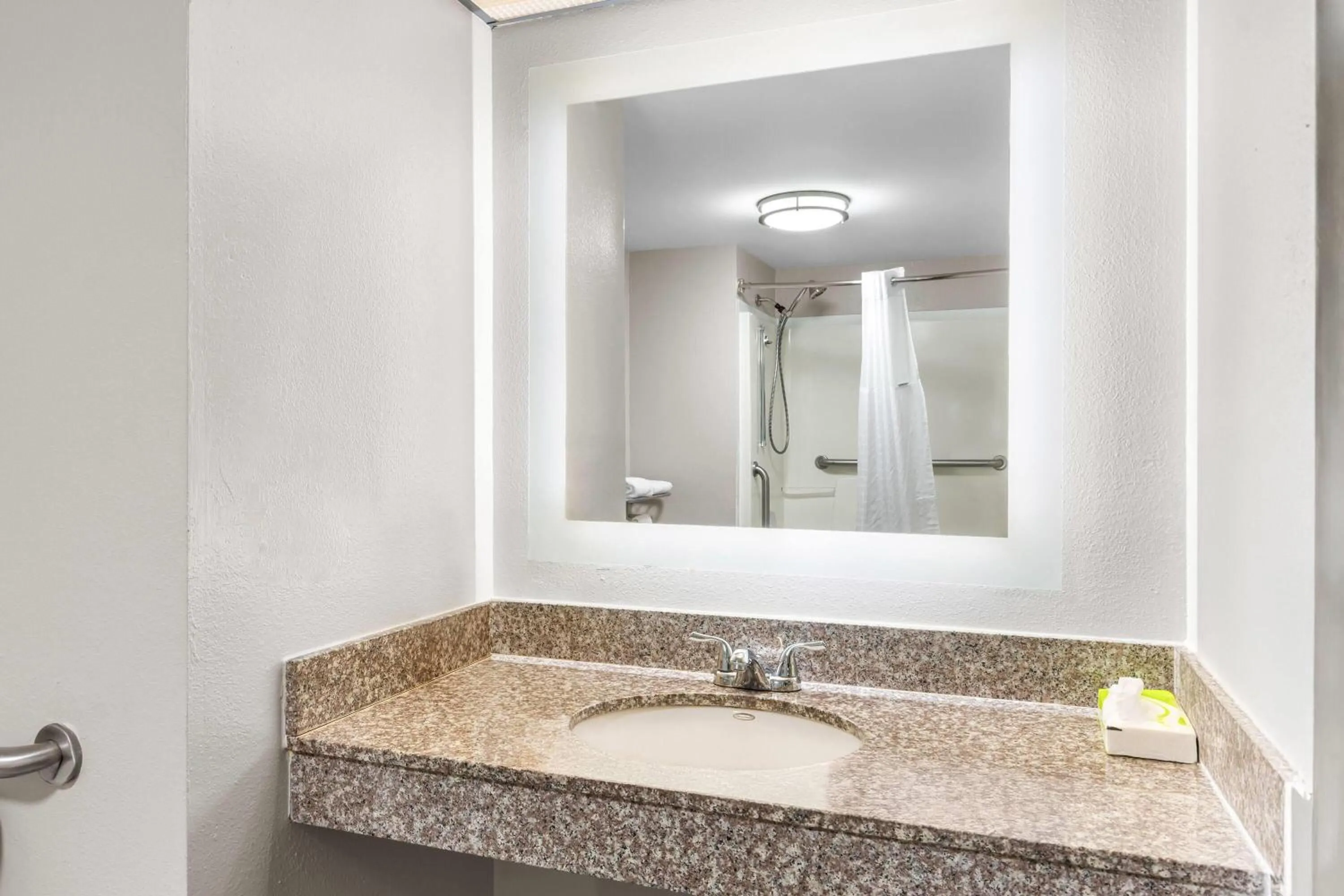 Bathroom in Days Inn by Wyndham Enterprise