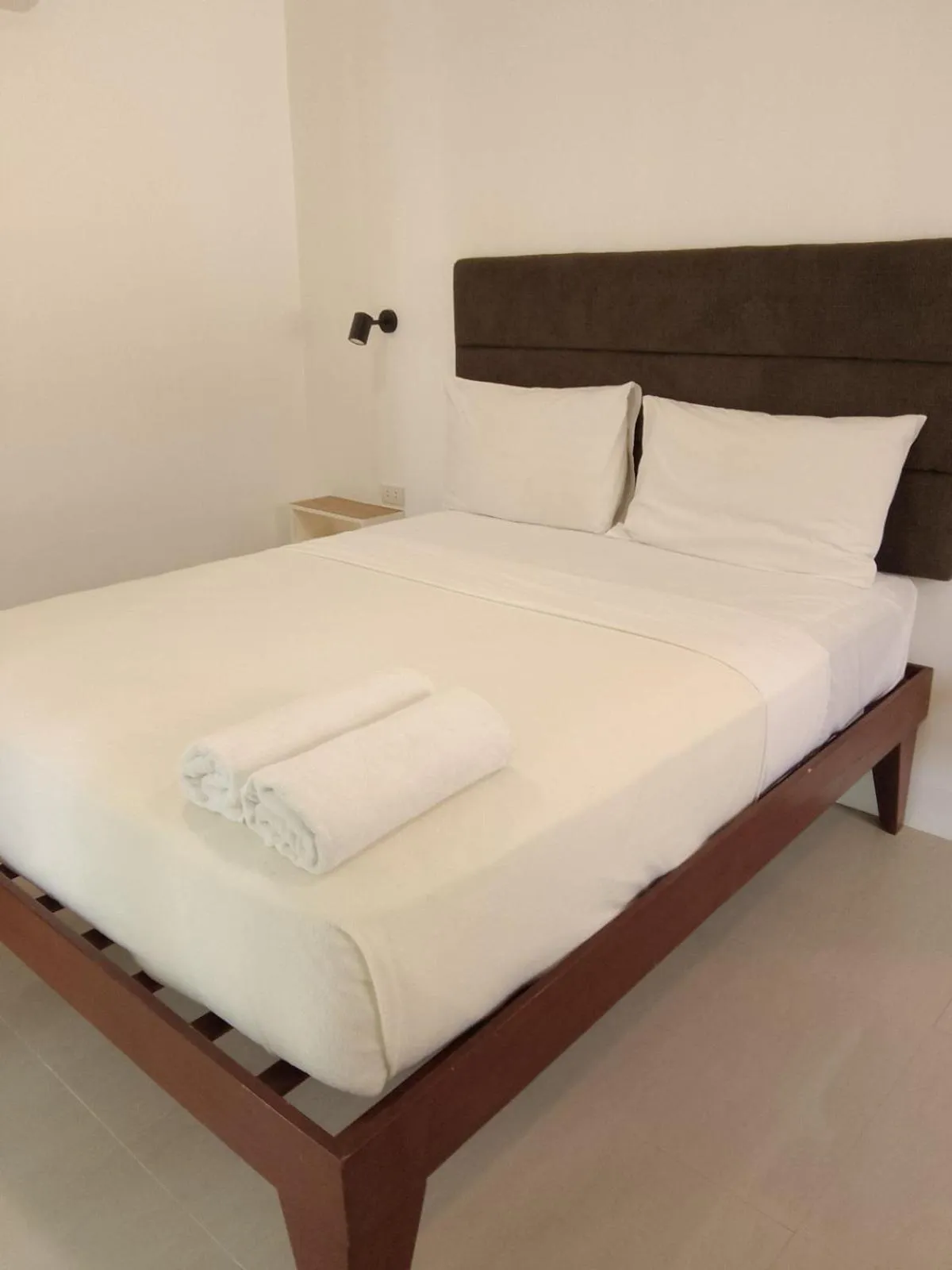 Bed in Heartland Hotel Serviced Rooms & Apartments.