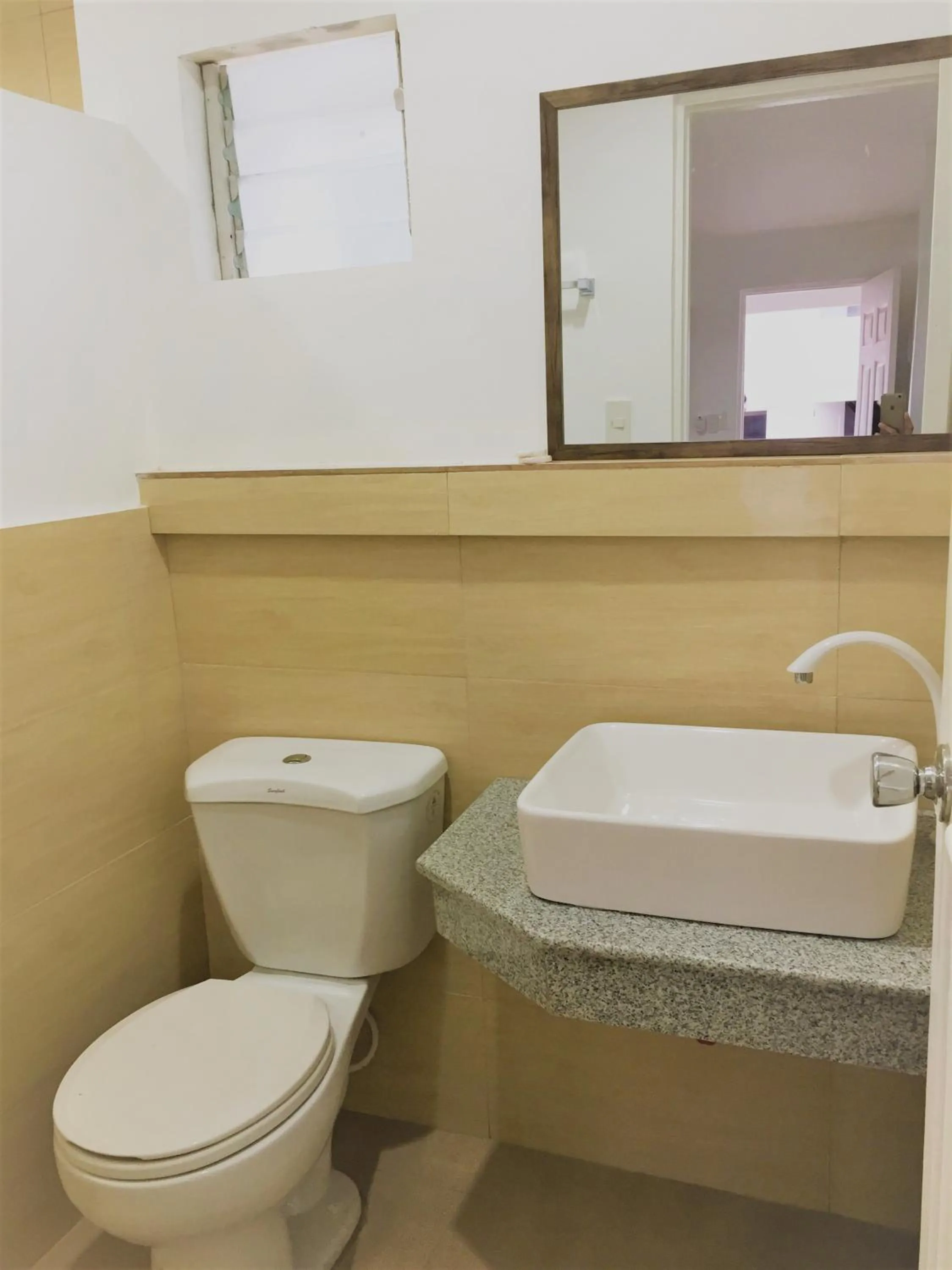 Toilet in Heartland Hotel Serviced Rooms & Apartments.