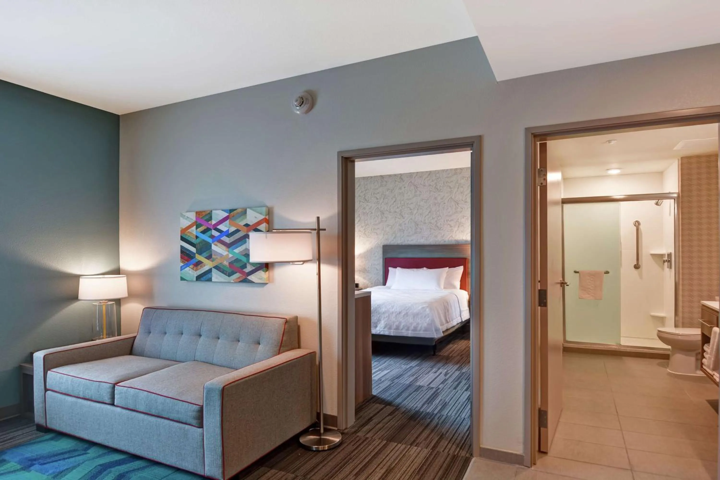 Living room, Bed in Home2 Suites By Hilton Daytona Beach Speedway