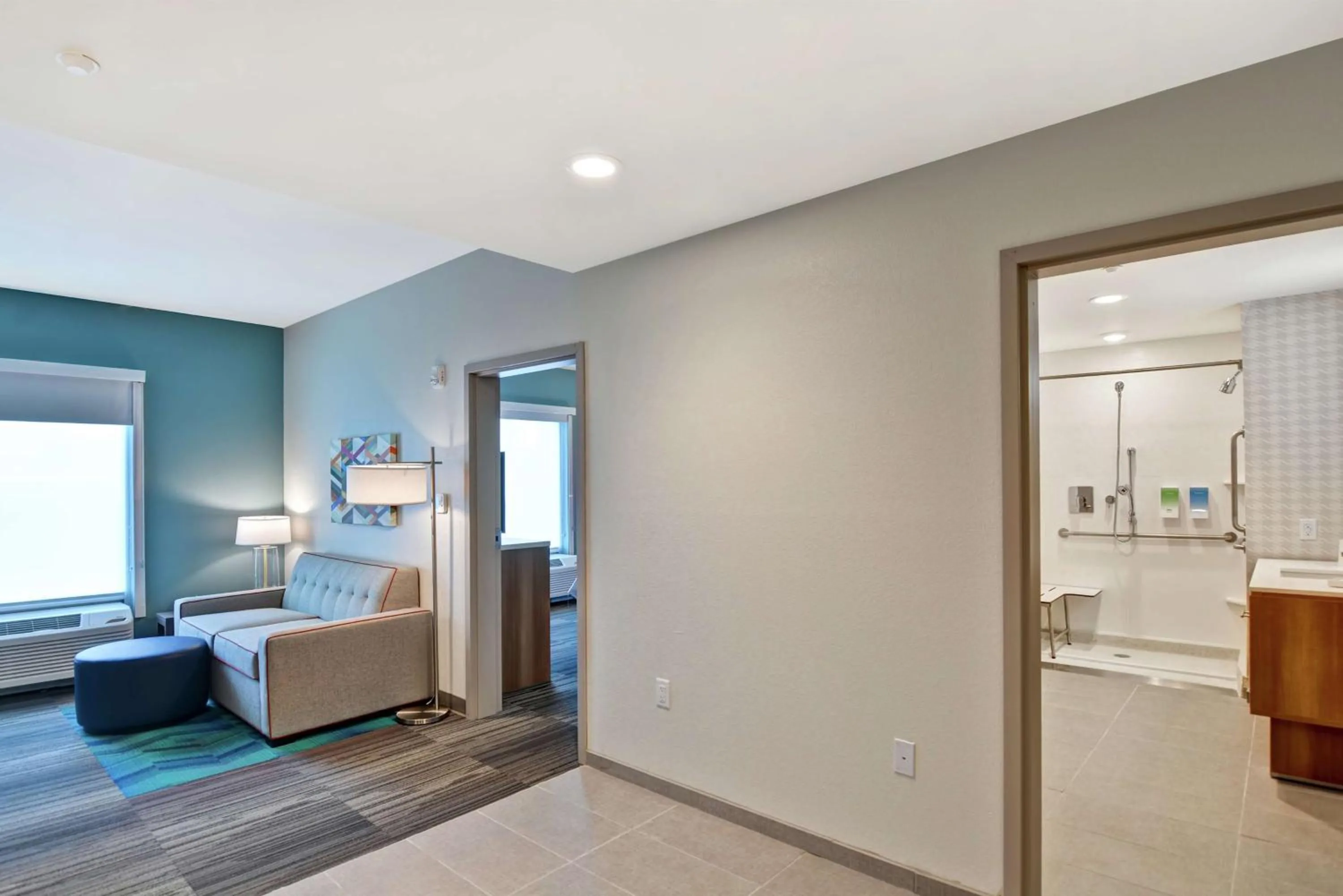 Living room, Bed in Home2 Suites By Hilton Daytona Beach Speedway