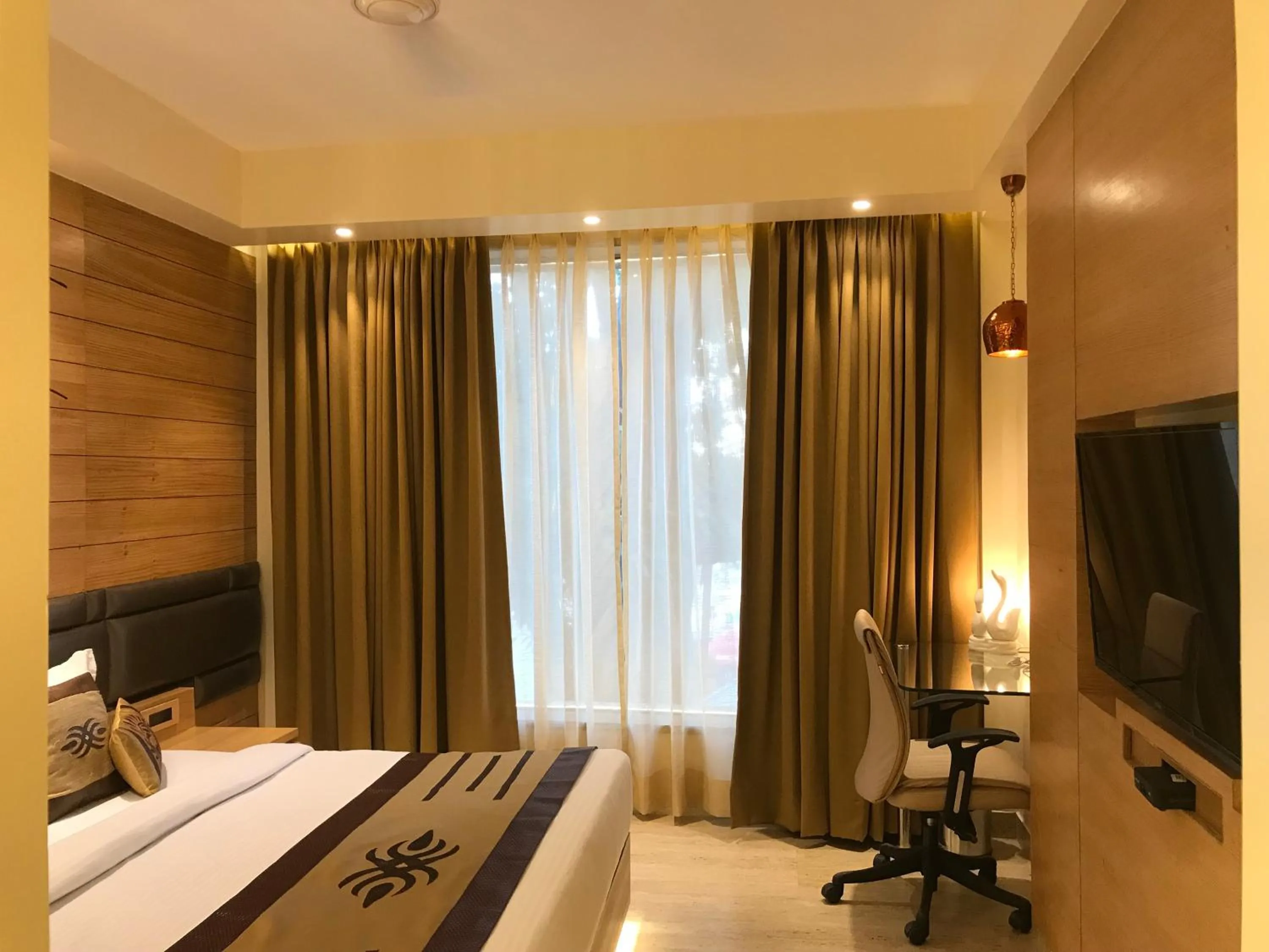 Bed in JRD Pride-Business Hotel