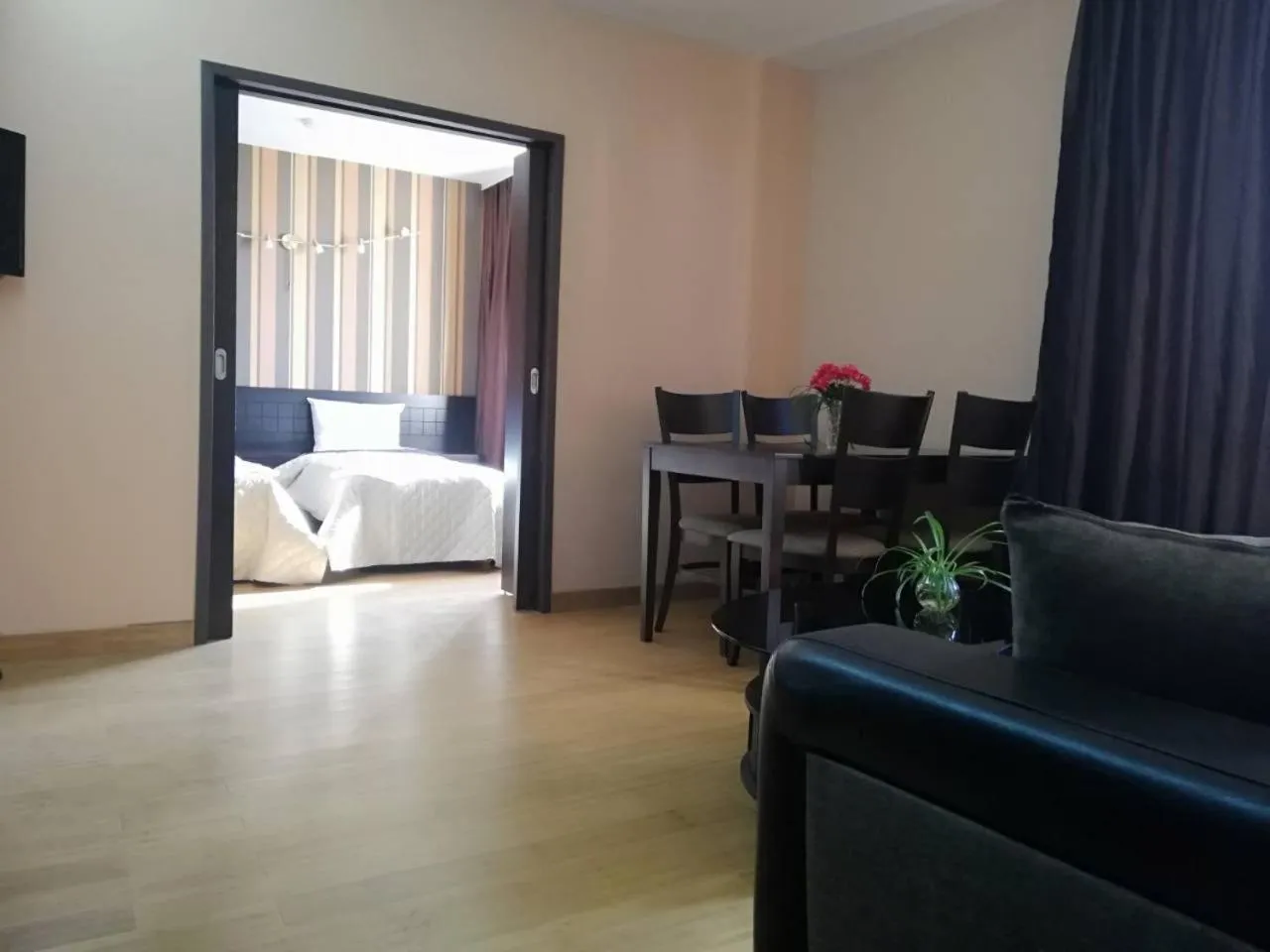 Living room, Bed in CityHome Aparthotel