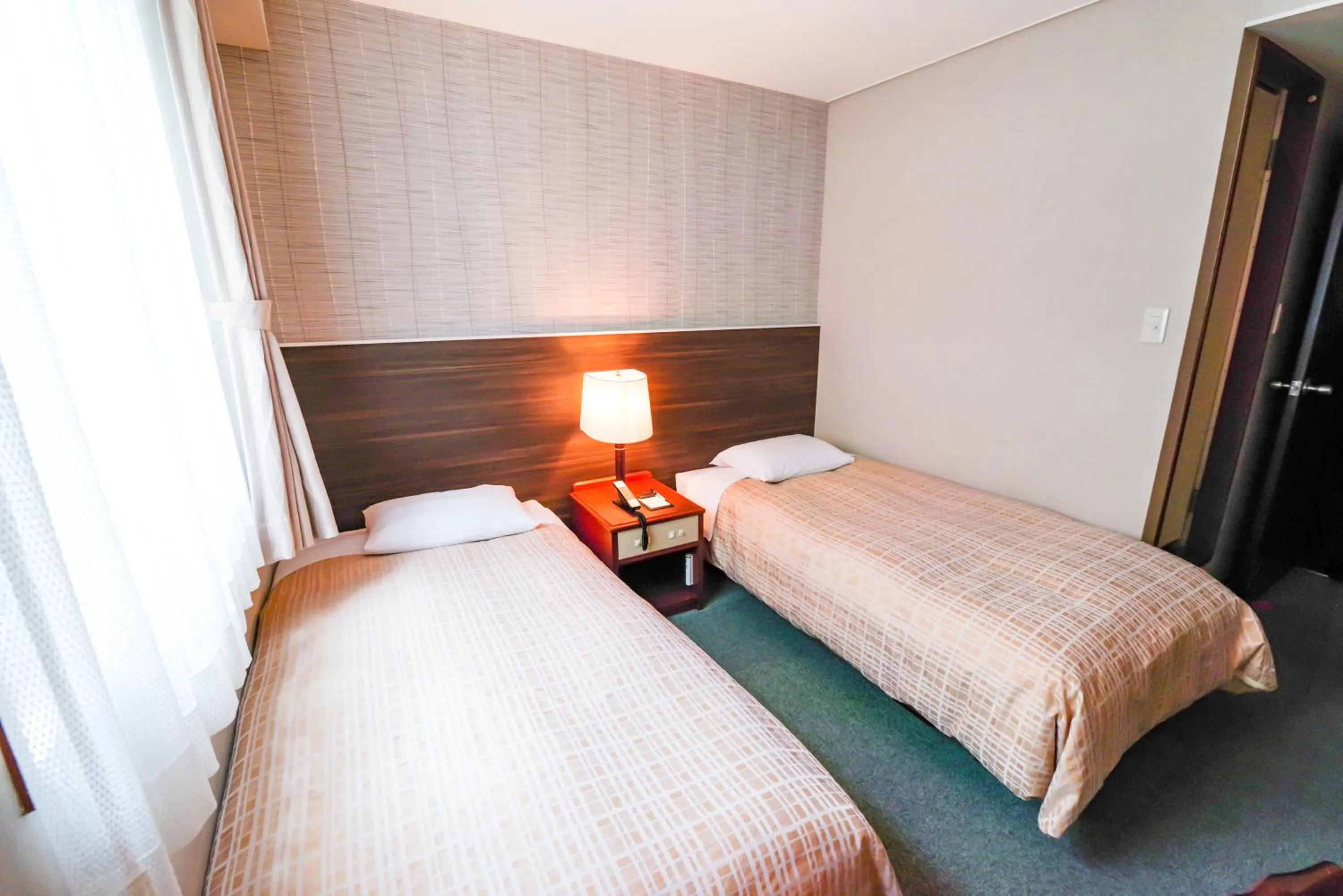 Bed in Reisenkaku Hotel Ekimae