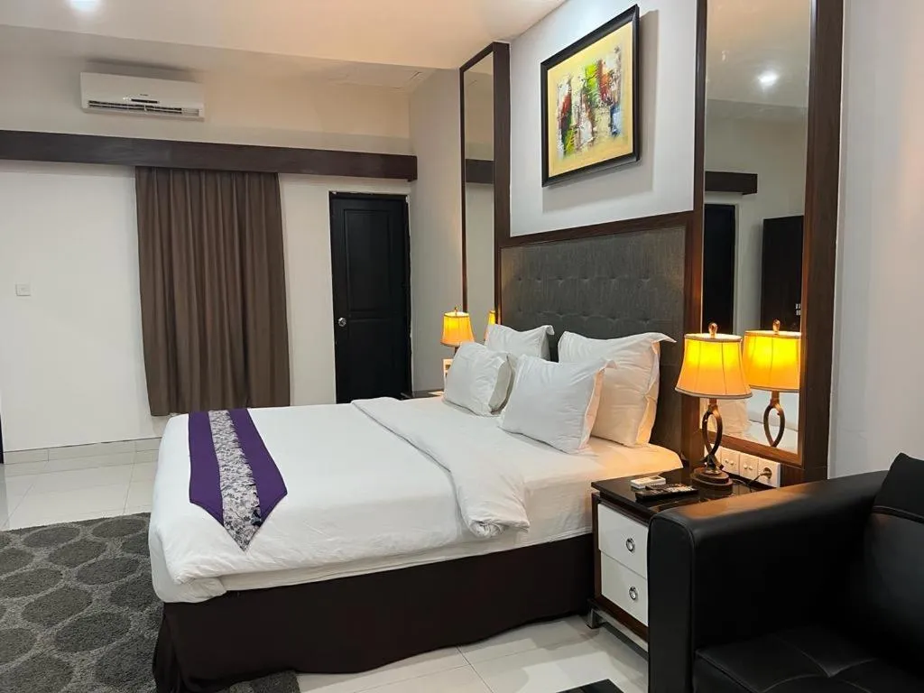 Bed in Ayla City Hotel