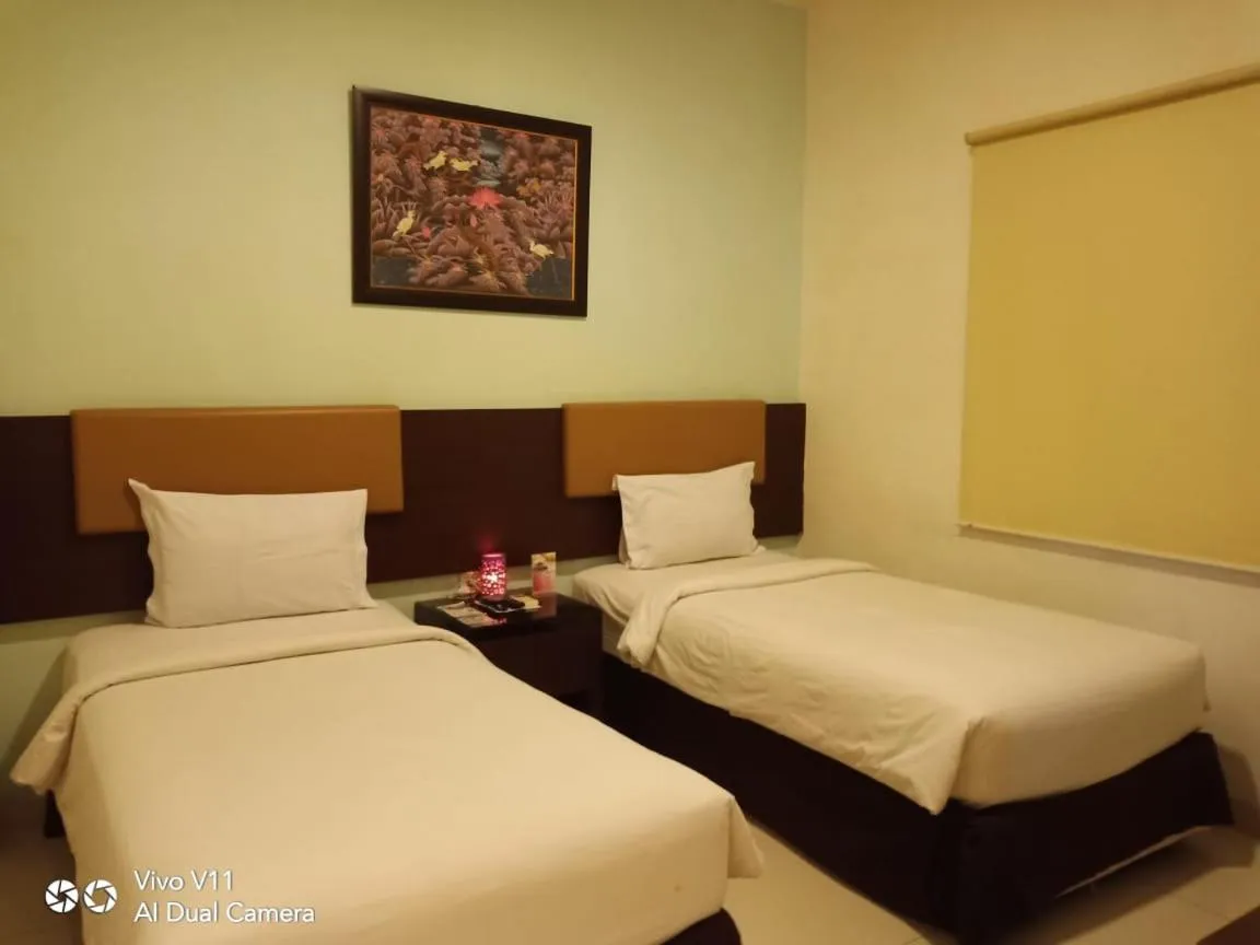Bed in Ayla City Hotel