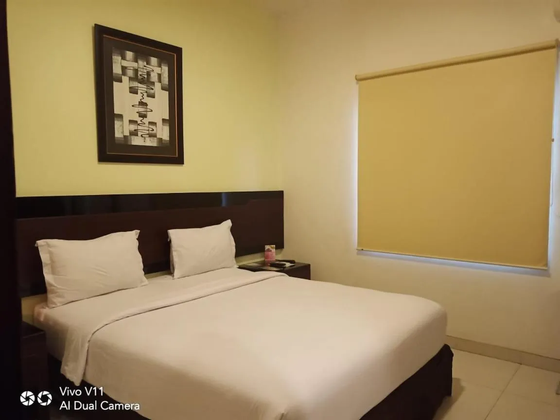 Bed in Ayla City Hotel