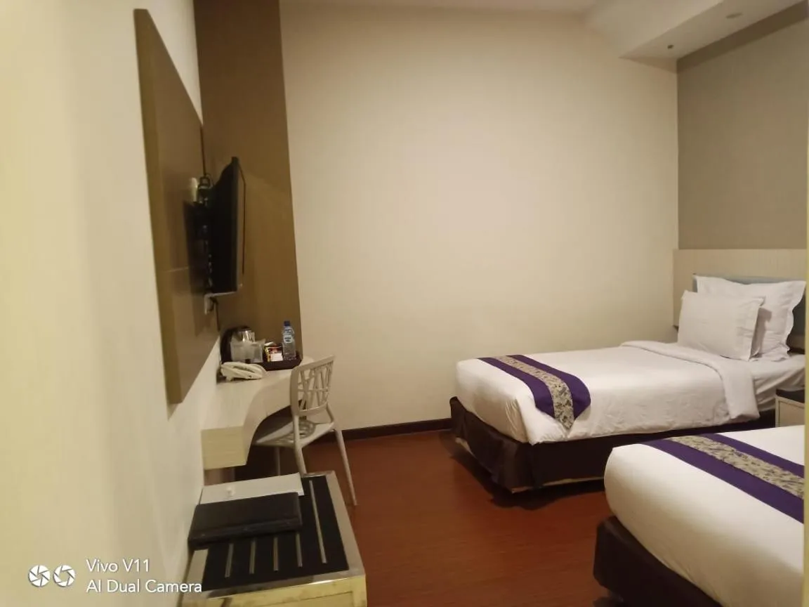 Bed in Ayla City Hotel