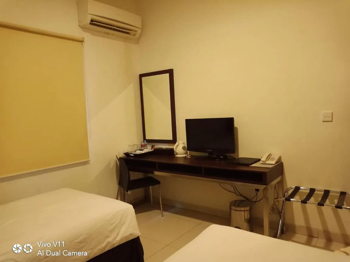 Bed in Ayla City Hotel