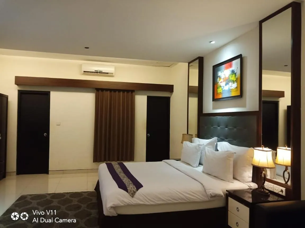 Bed in Ayla City Hotel