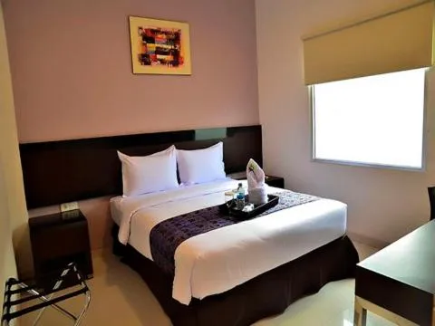 Bed in Ayla City Hotel