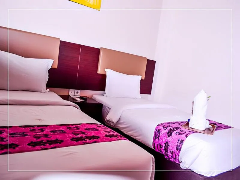 Bed in Ayla City Hotel