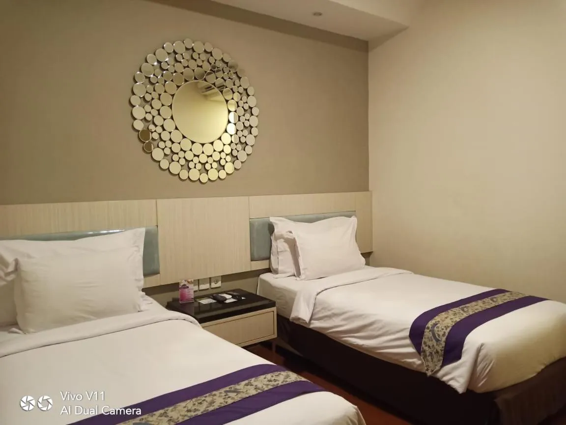 Bed in Ayla City Hotel