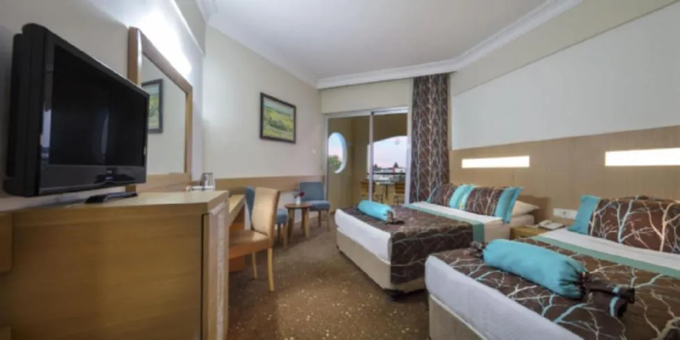 Bed in Saphir Hotel & Villas